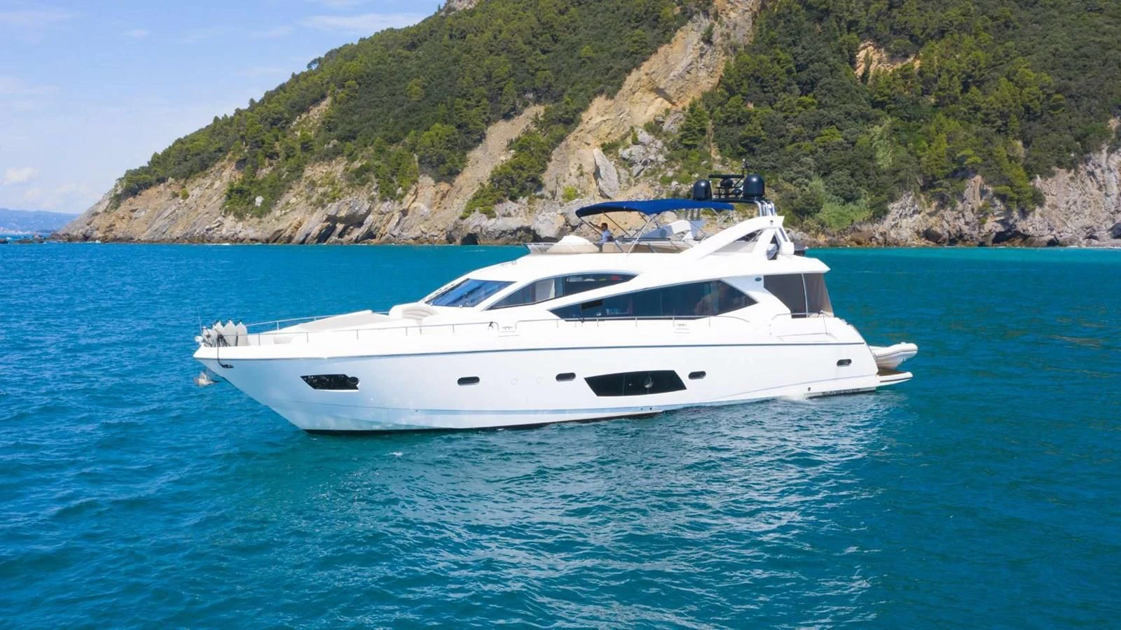 a white yacht in the water aboard SUNSEEKER 70' MANHATTAN Yacht for Sale