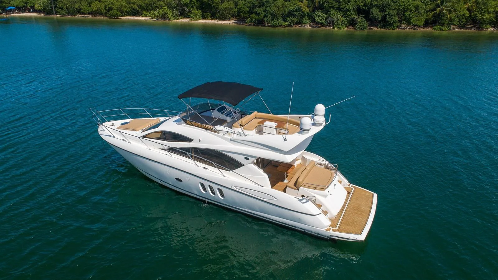 a boat on the water aboard SUNSEEKER 70' MANHATTAN Yacht for Sale