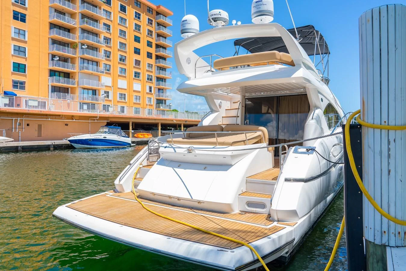 a boat docked in a harbor aboard SUNSEEKER 70' MANHATTAN Yacht for Sale
