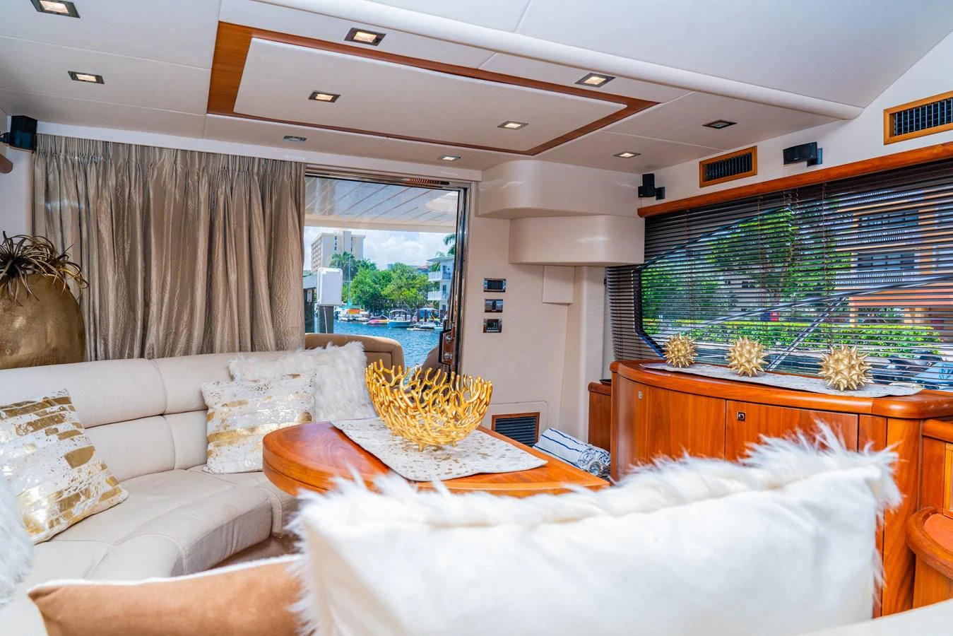 a living room with a large window aboard SUNSEEKER 70' MANHATTAN Yacht for Sale