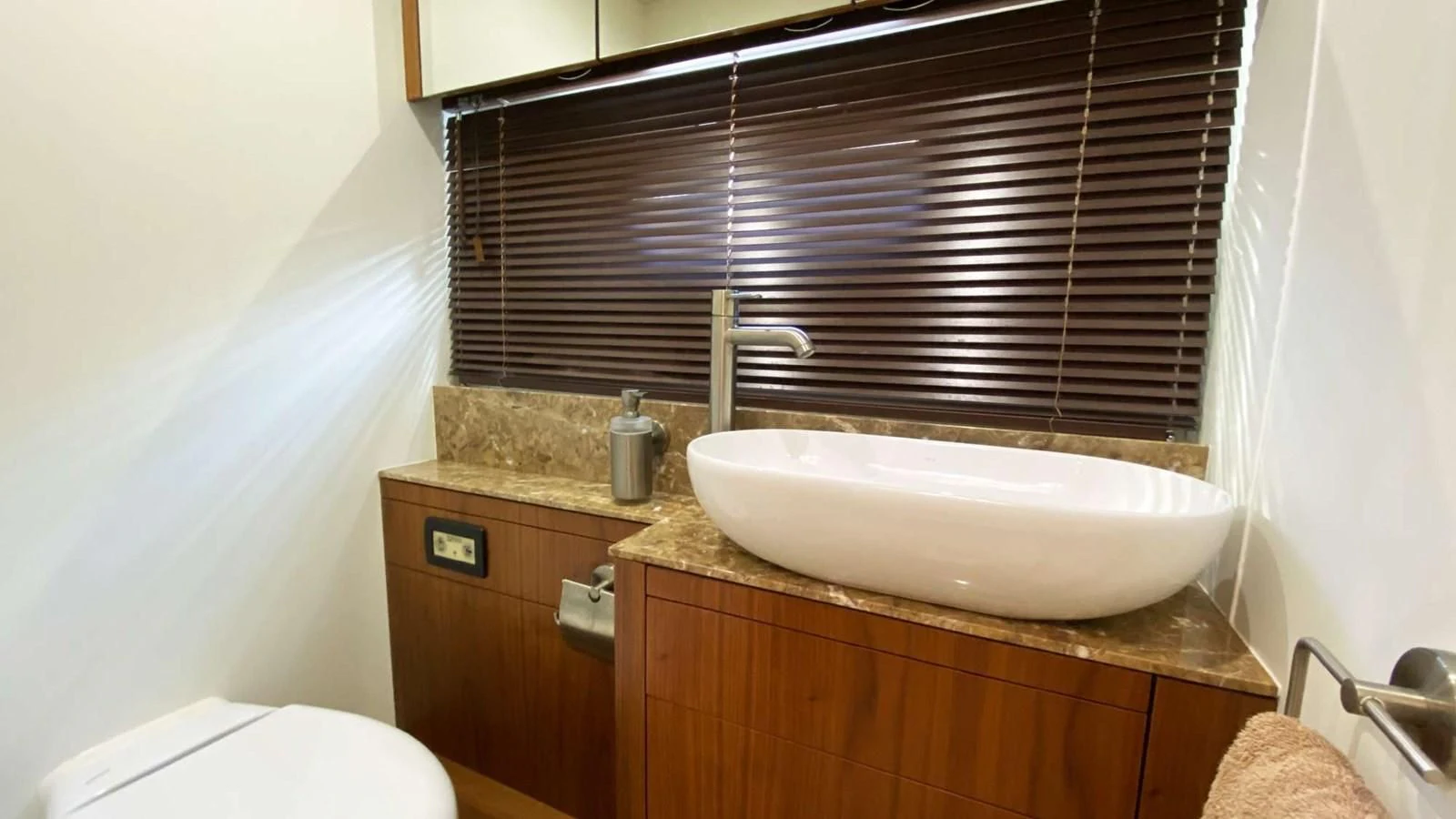 a bathroom with a sink and a toilet aboard SUNSEEKER 70' MANHATTAN Yacht for Sale