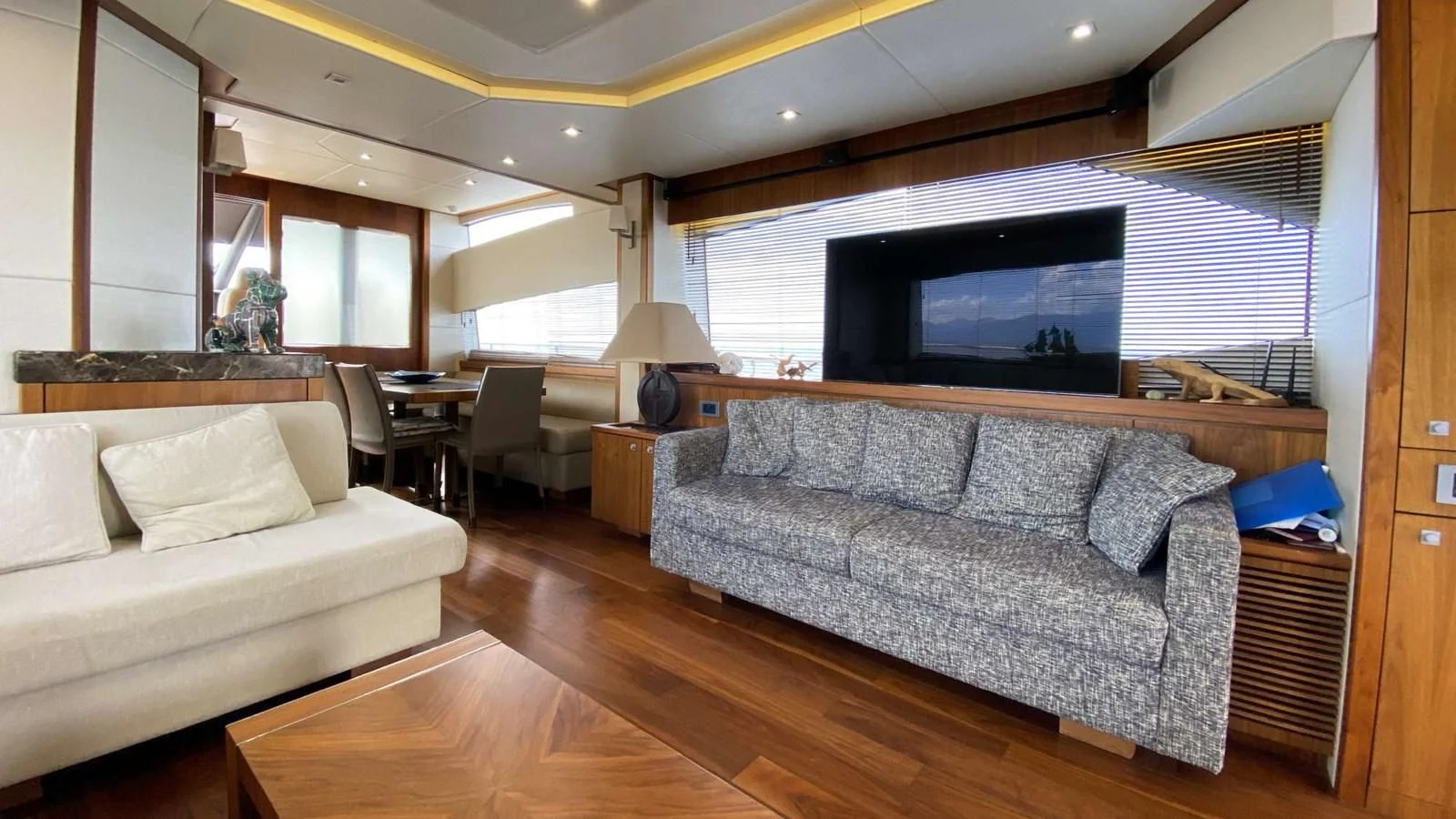 a living room with a large television aboard SUNSEEKER 70' MANHATTAN Yacht for Sale