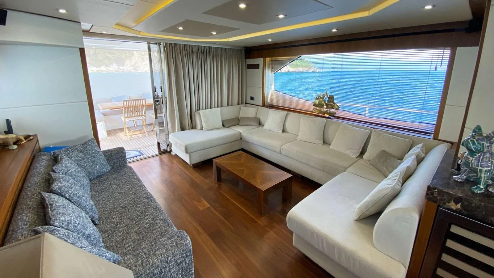 a living room with a large window aboard SUNSEEKER 70' MANHATTAN Yacht for Sale