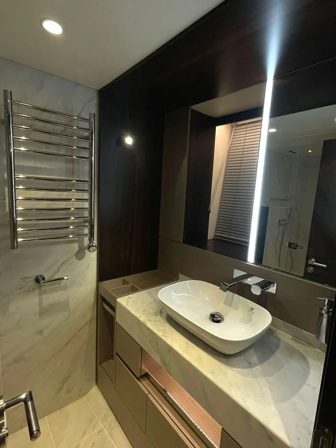 a bathroom with a sink and a mirror aboard SUNSEEKER 70' MANHATTAN Yacht for Sale