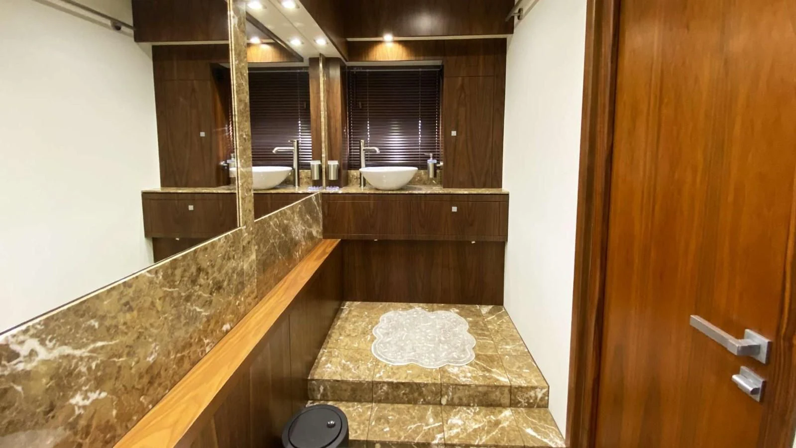 a bathroom with marble counter tops aboard SUNSEEKER 70' MANHATTAN Yacht for Sale