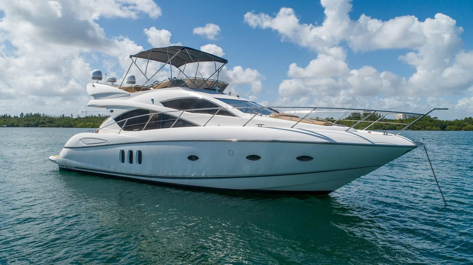 a white yacht in the water aboard SUNSEEKER 70' MANHATTAN Yacht for Sale