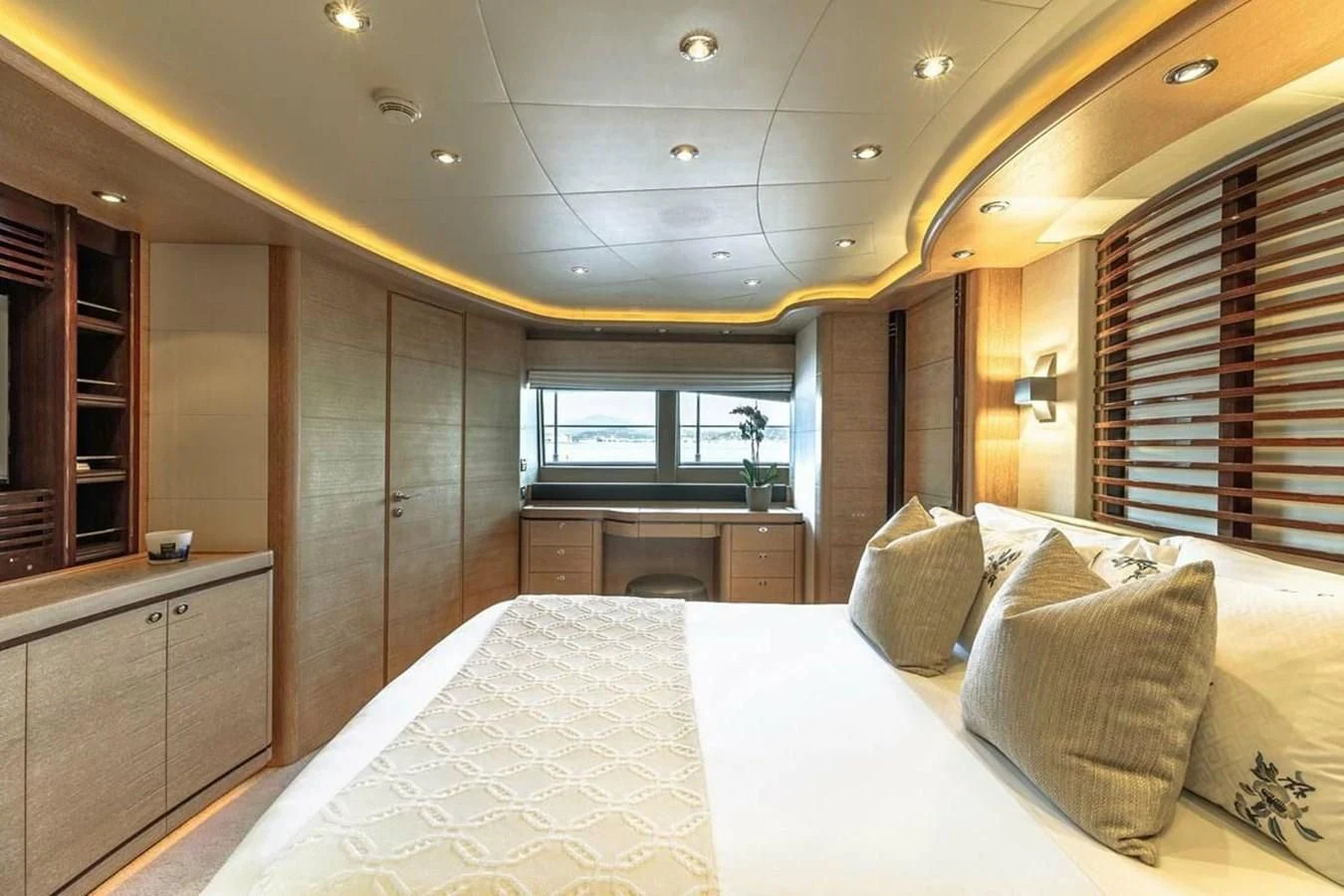 a large bedroom with a large bed aboard AERO Yacht for Charter