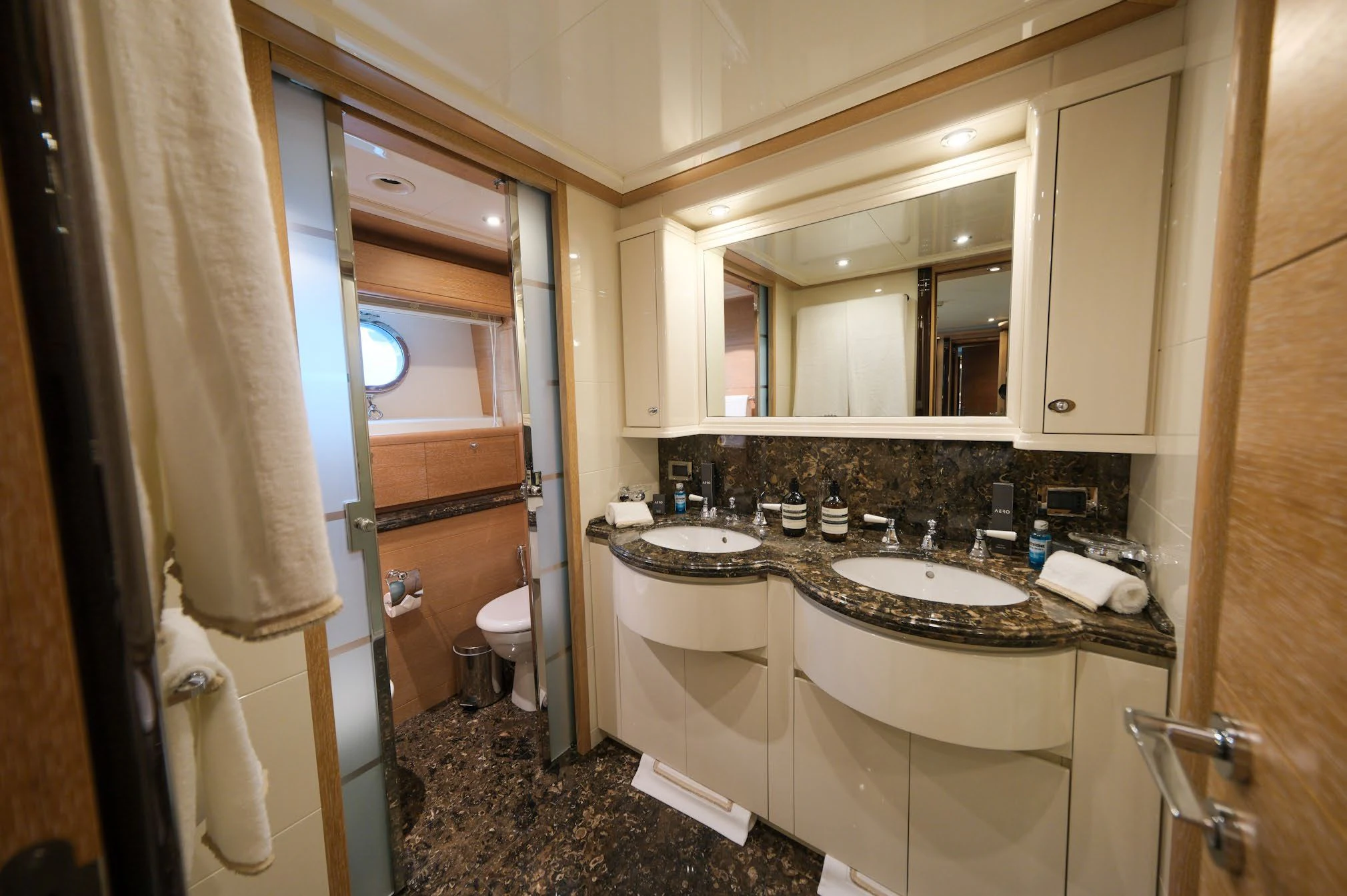 a bathroom with a sink and a mirror aboard AERO Yacht for Charter