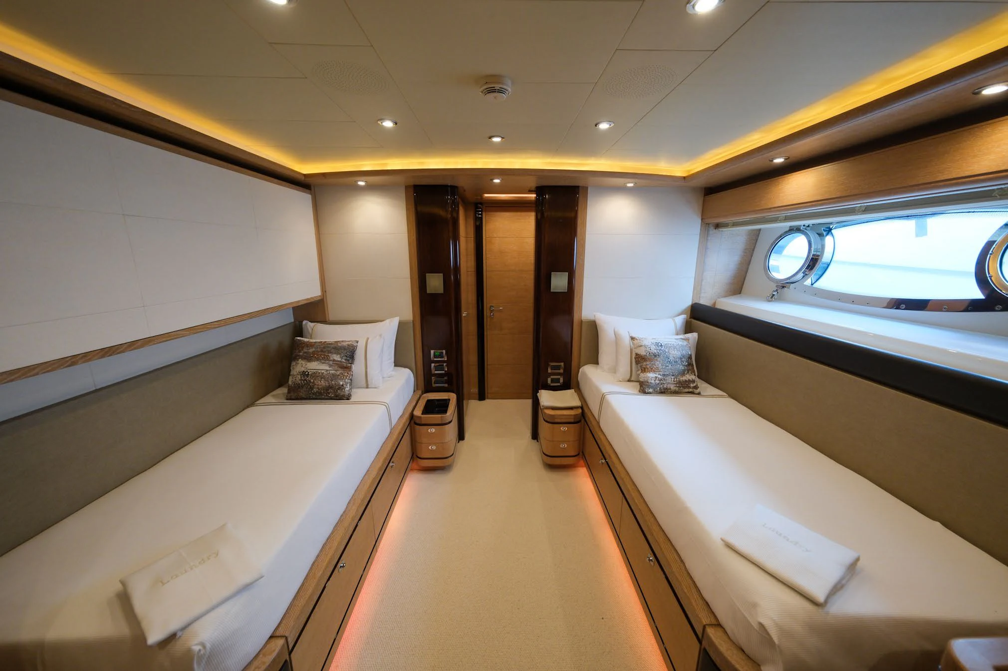 a room with a bed and a window aboard AERO Yacht for Charter