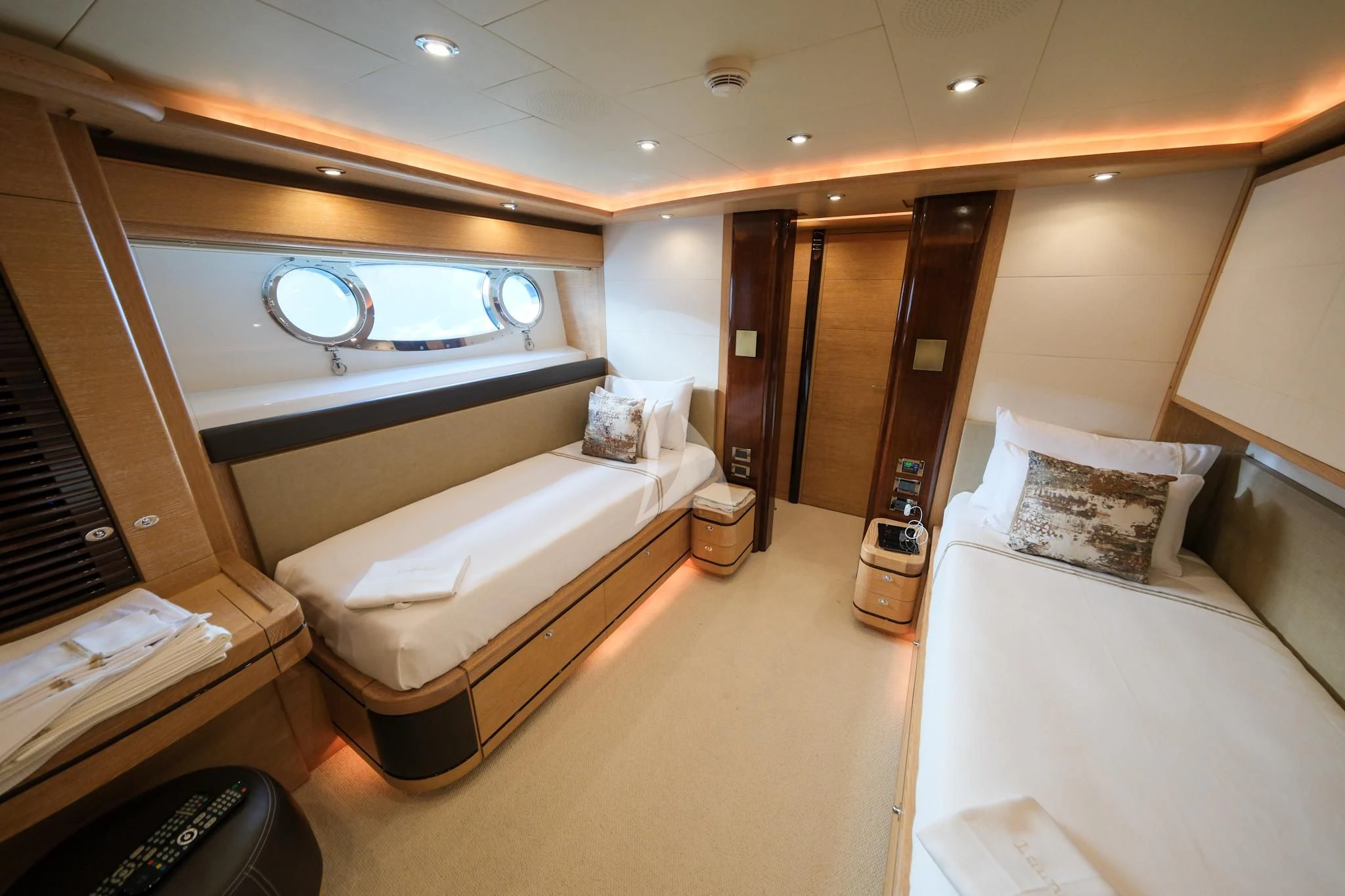 a room with a bed and a mirror aboard AERO Yacht for Charter
