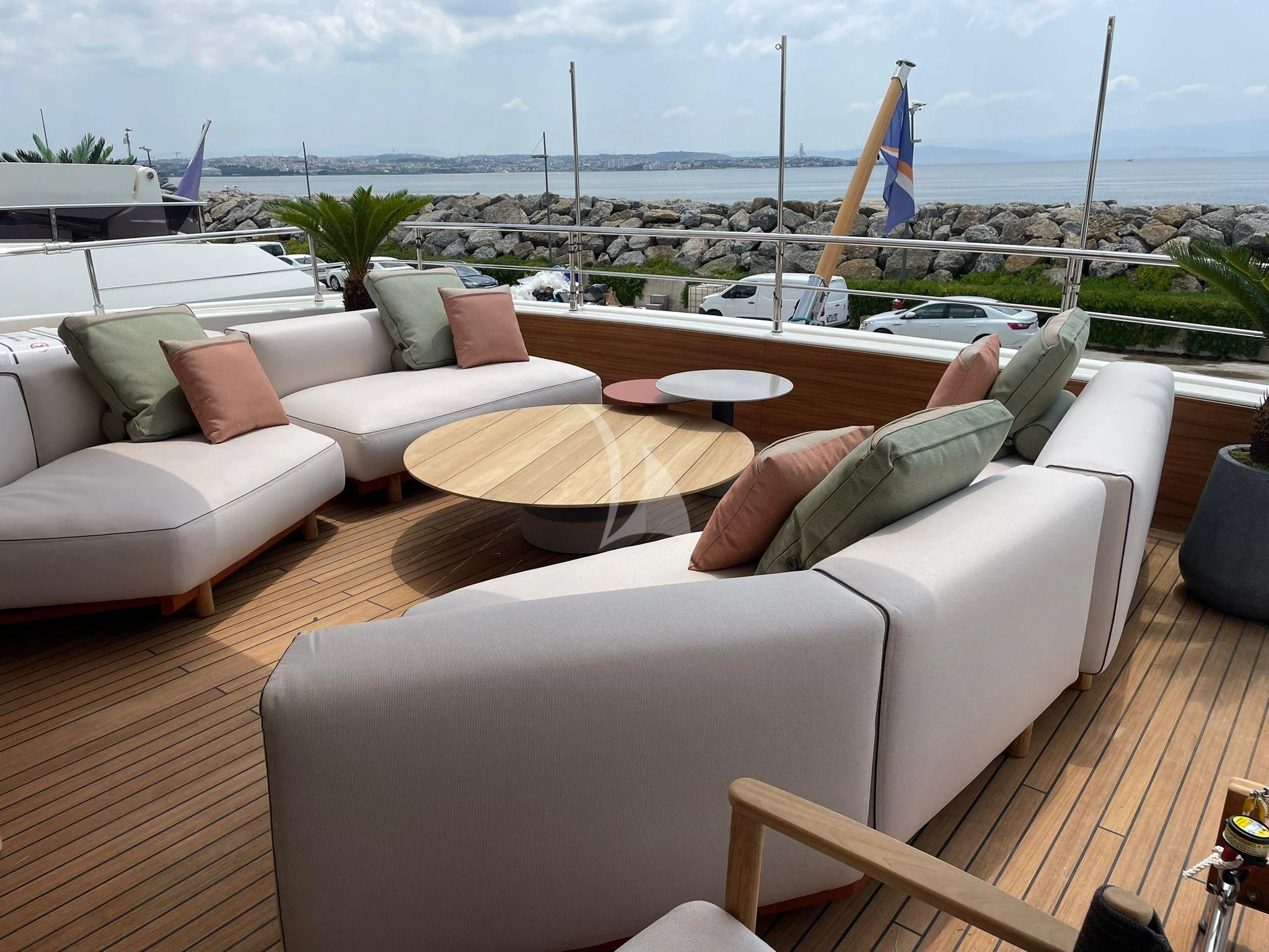 a room with couches and chairs aboard AERO Yacht for Charter