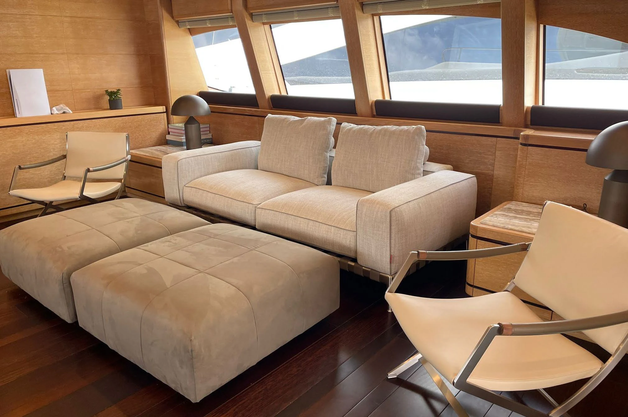 a living room with a couch and a window aboard AERO Yacht for Charter