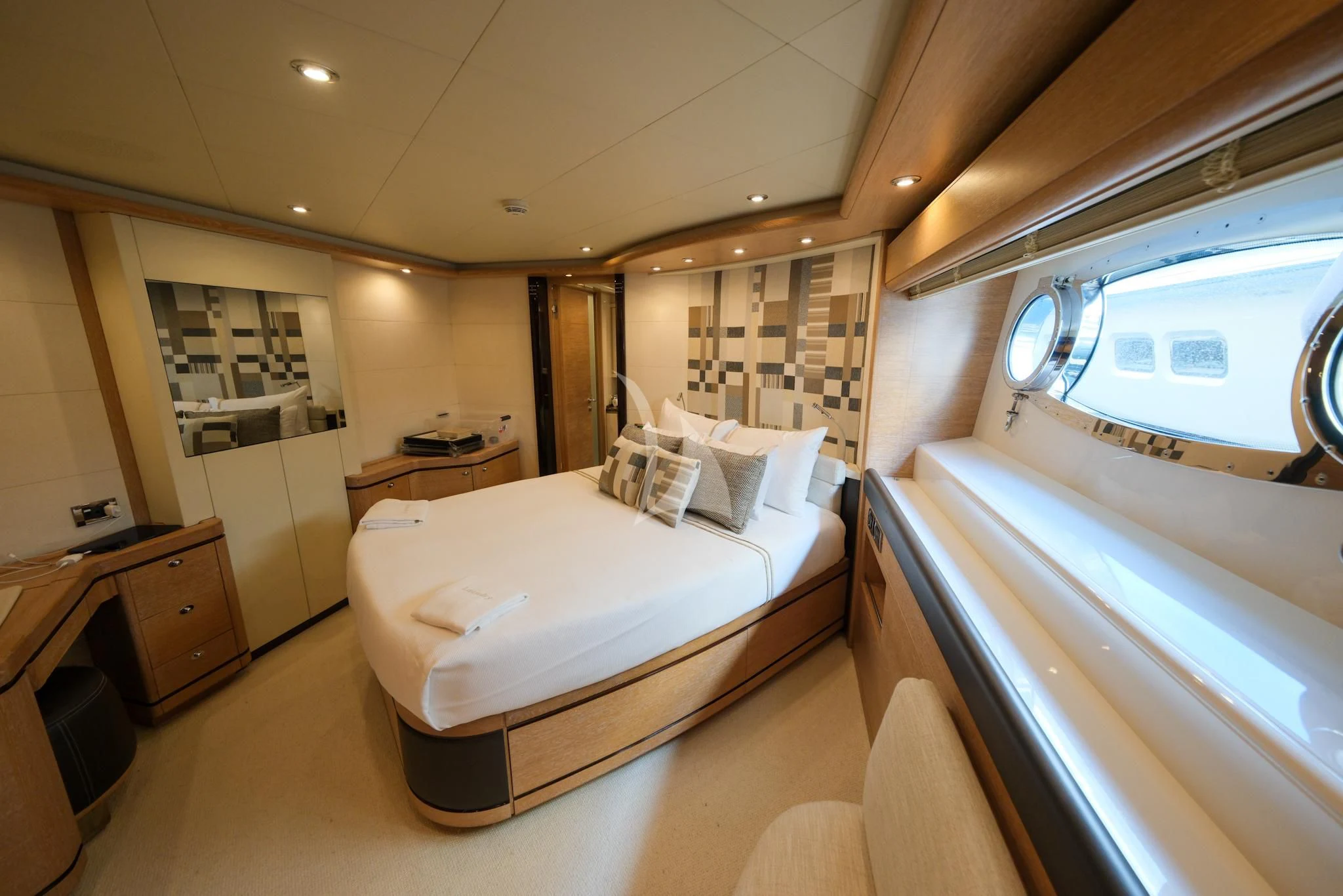 a room with a couple of beds aboard AERO Yacht for Charter