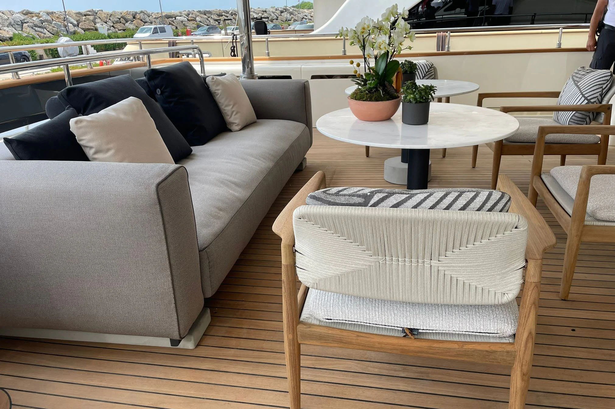 a couch and a table in a room with a window aboard AERO Yacht for Charter