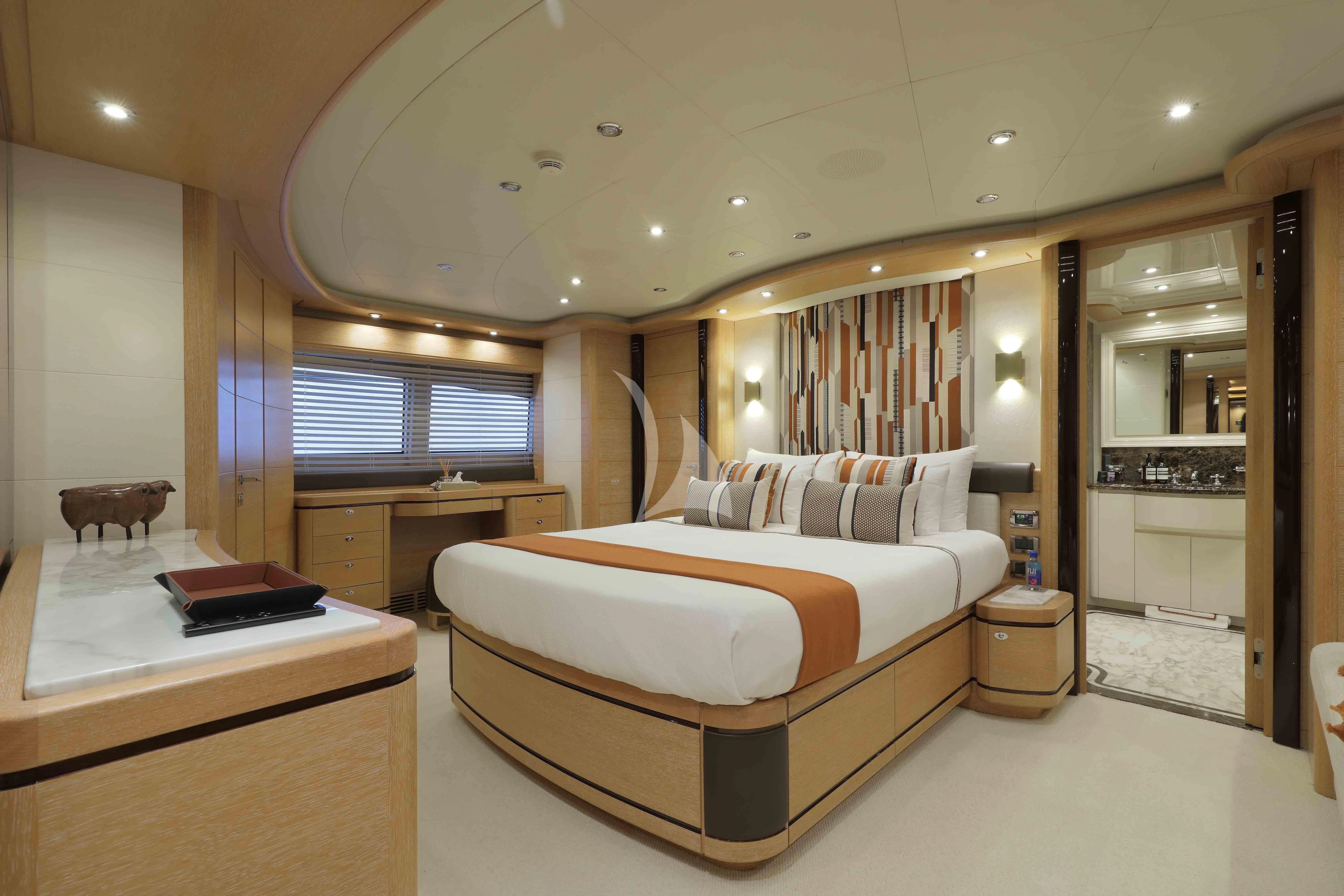 a bedroom with a bed and a desk aboard AERO Yacht for Charter
