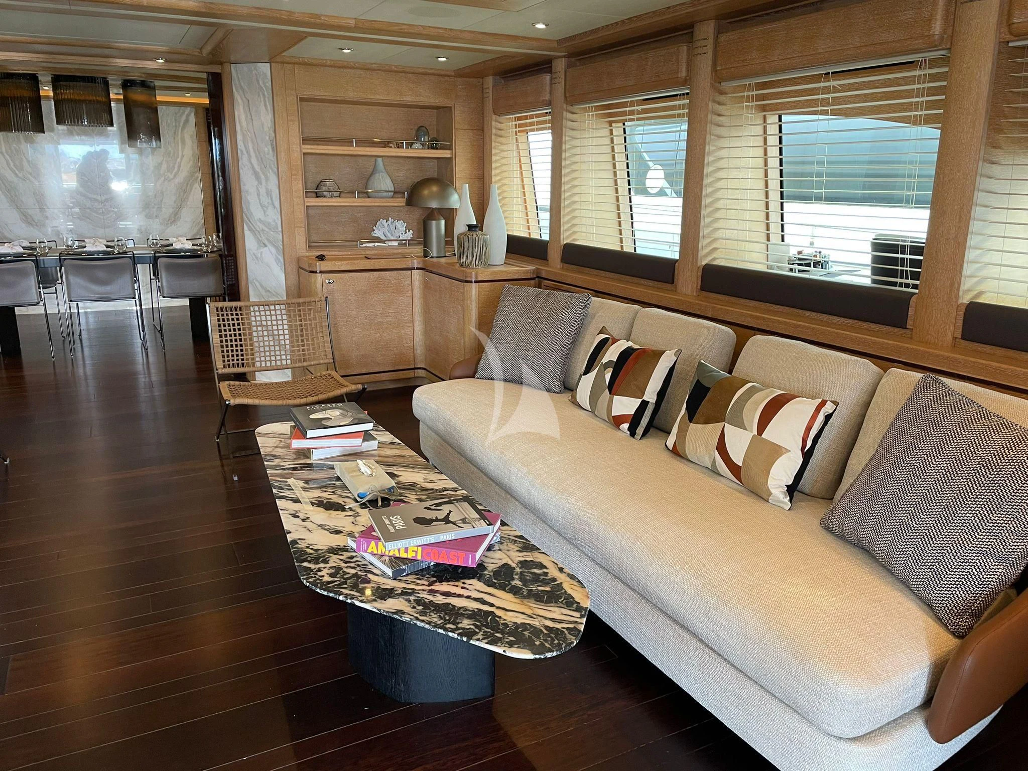 a living room with a couch and a coffee table aboard AERO Yacht for Charter