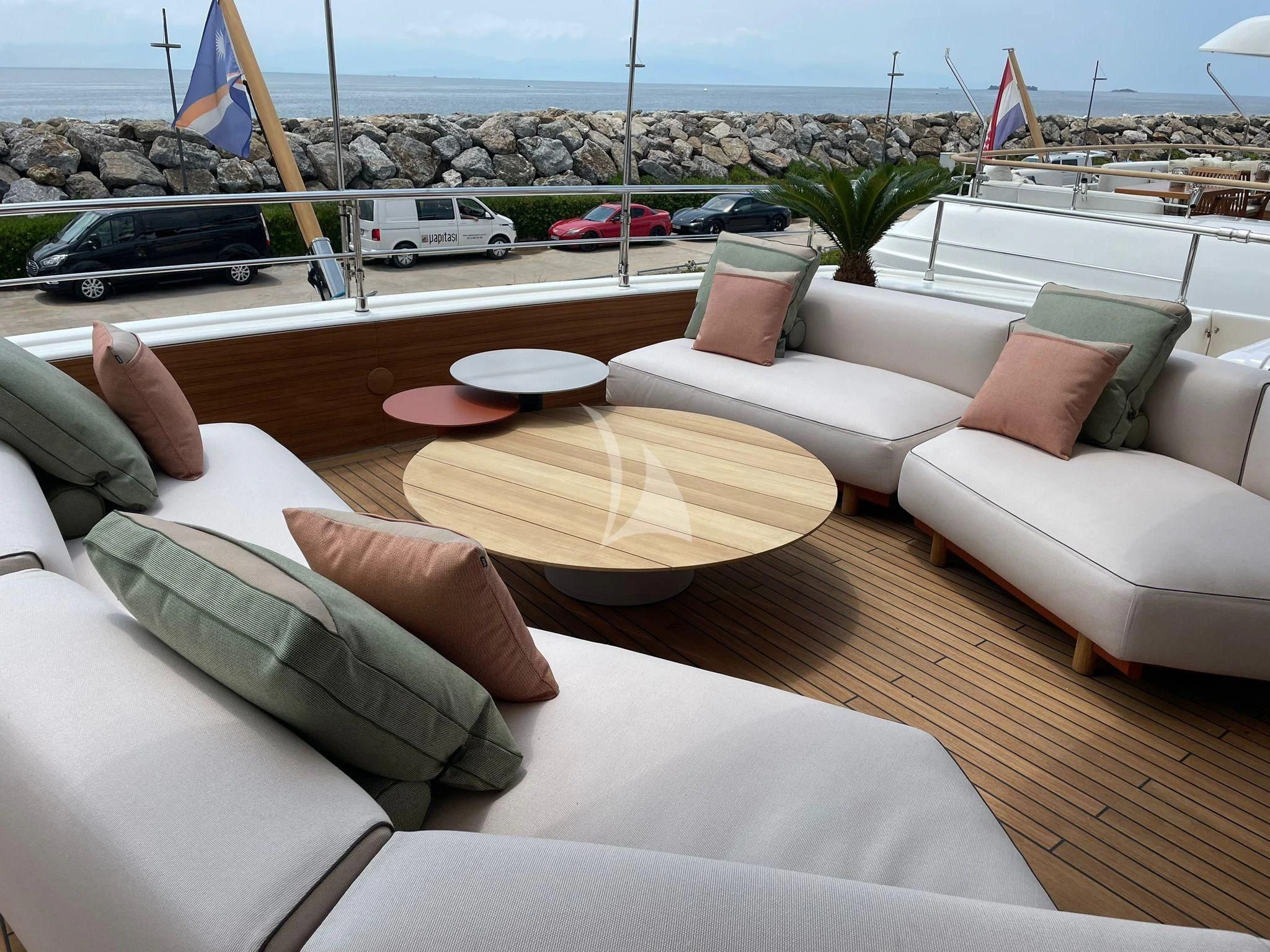 a couch with pillows on it aboard AERO Yacht for Charter