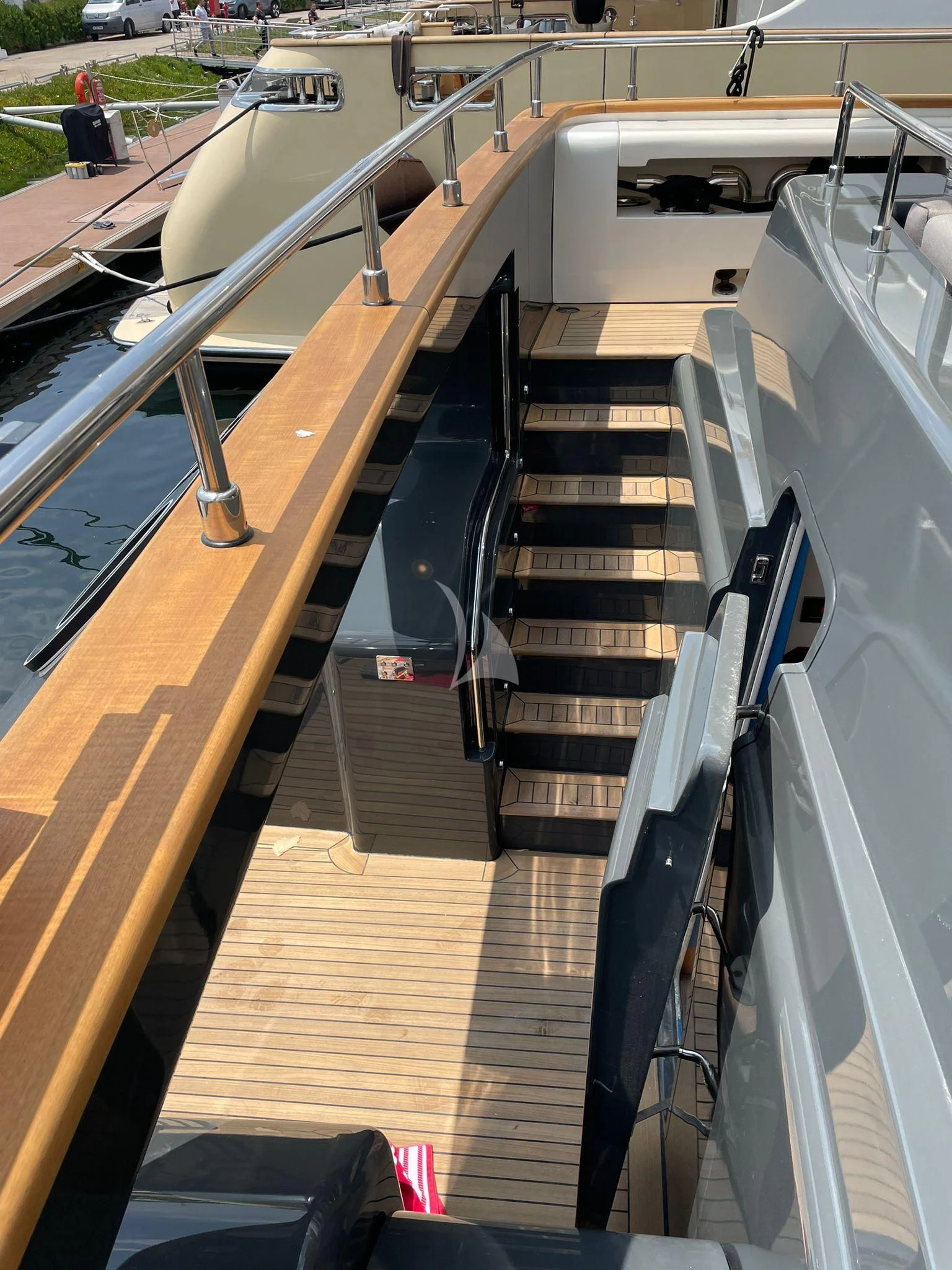 a set of stairs with a wood railing aboard AERO Yacht for Charter
