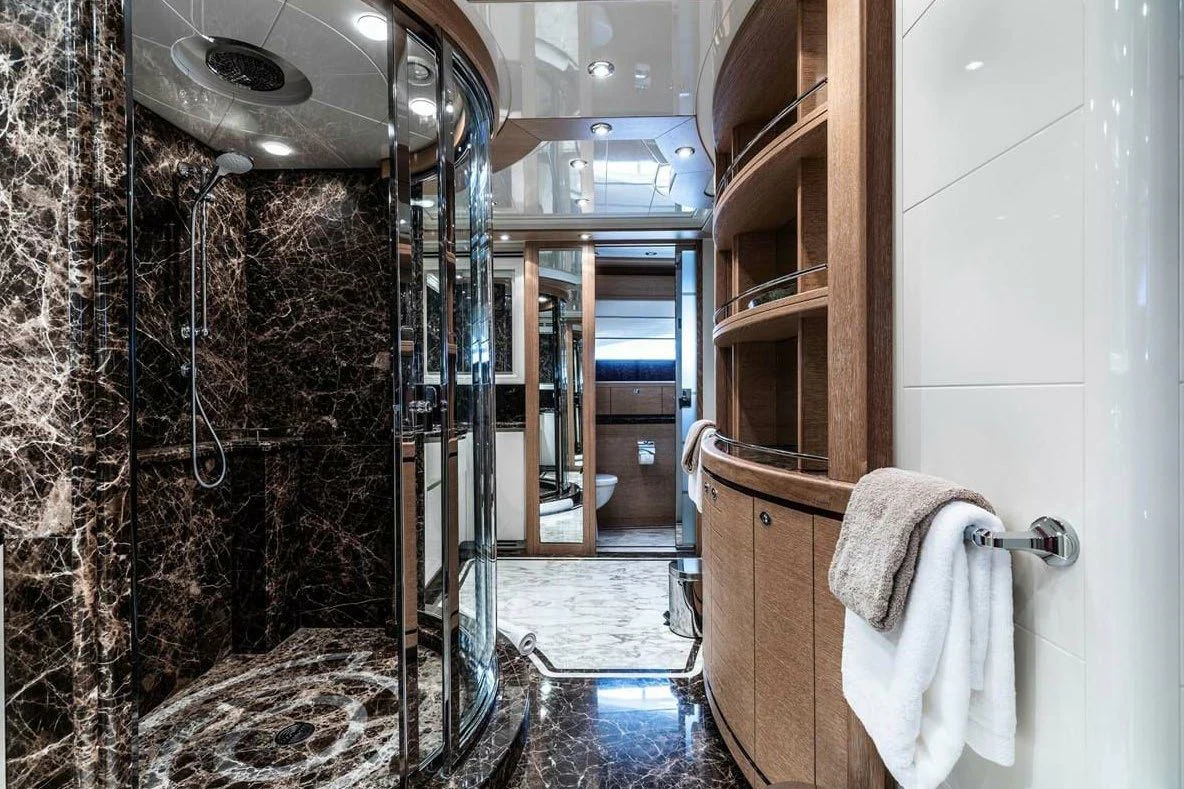a bathroom with a shower and sink aboard AERO Yacht for Charter