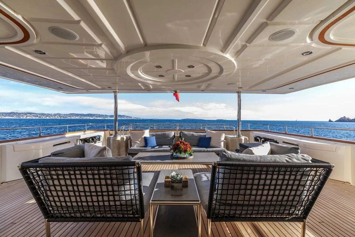 a room with a table and chairs aboard AERO Yacht for Charter