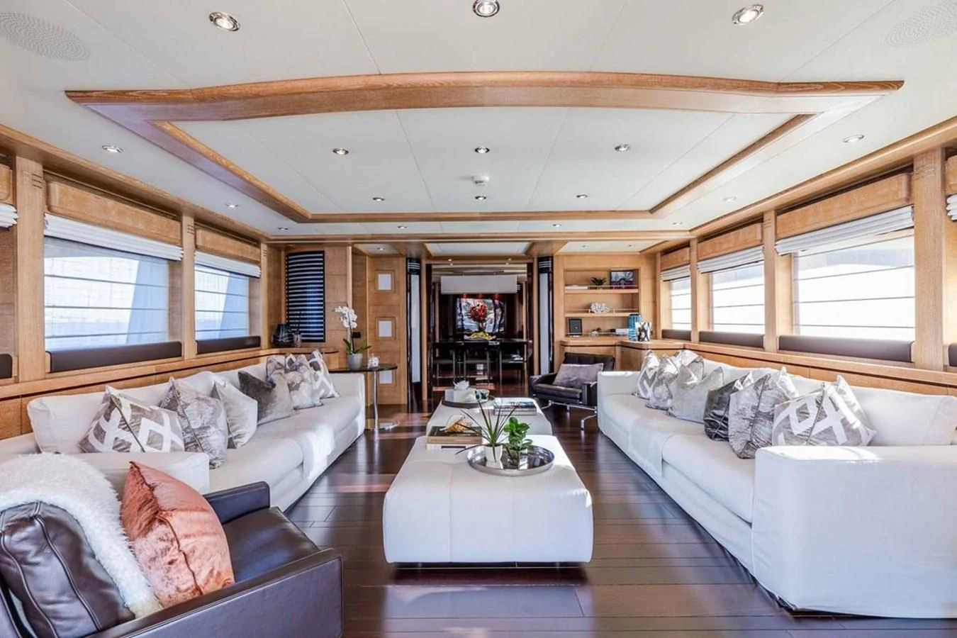 a living room with a couch and a table aboard AERO Yacht for Charter
