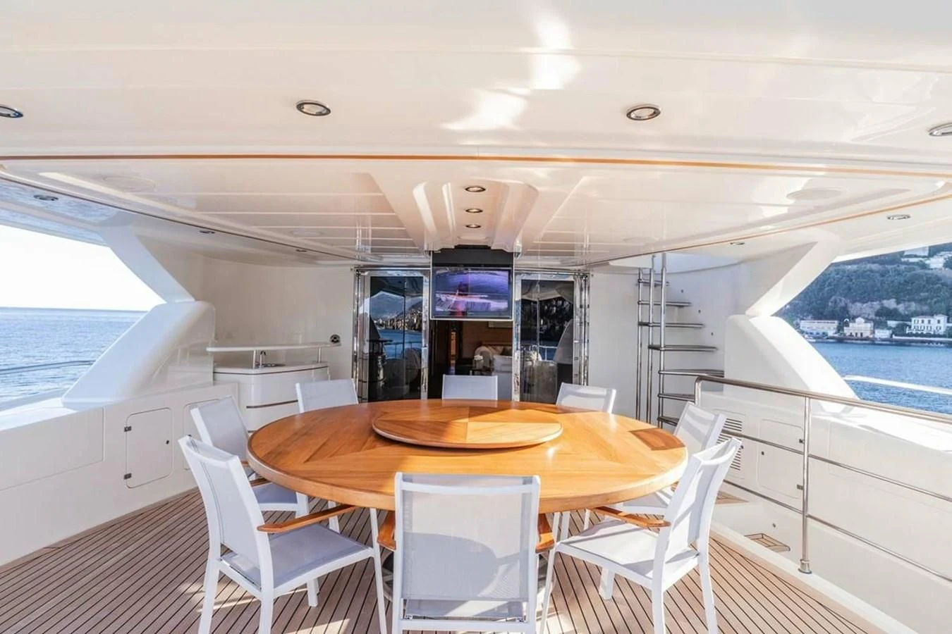 a table and chairs on a boat aboard AERO Yacht for Charter