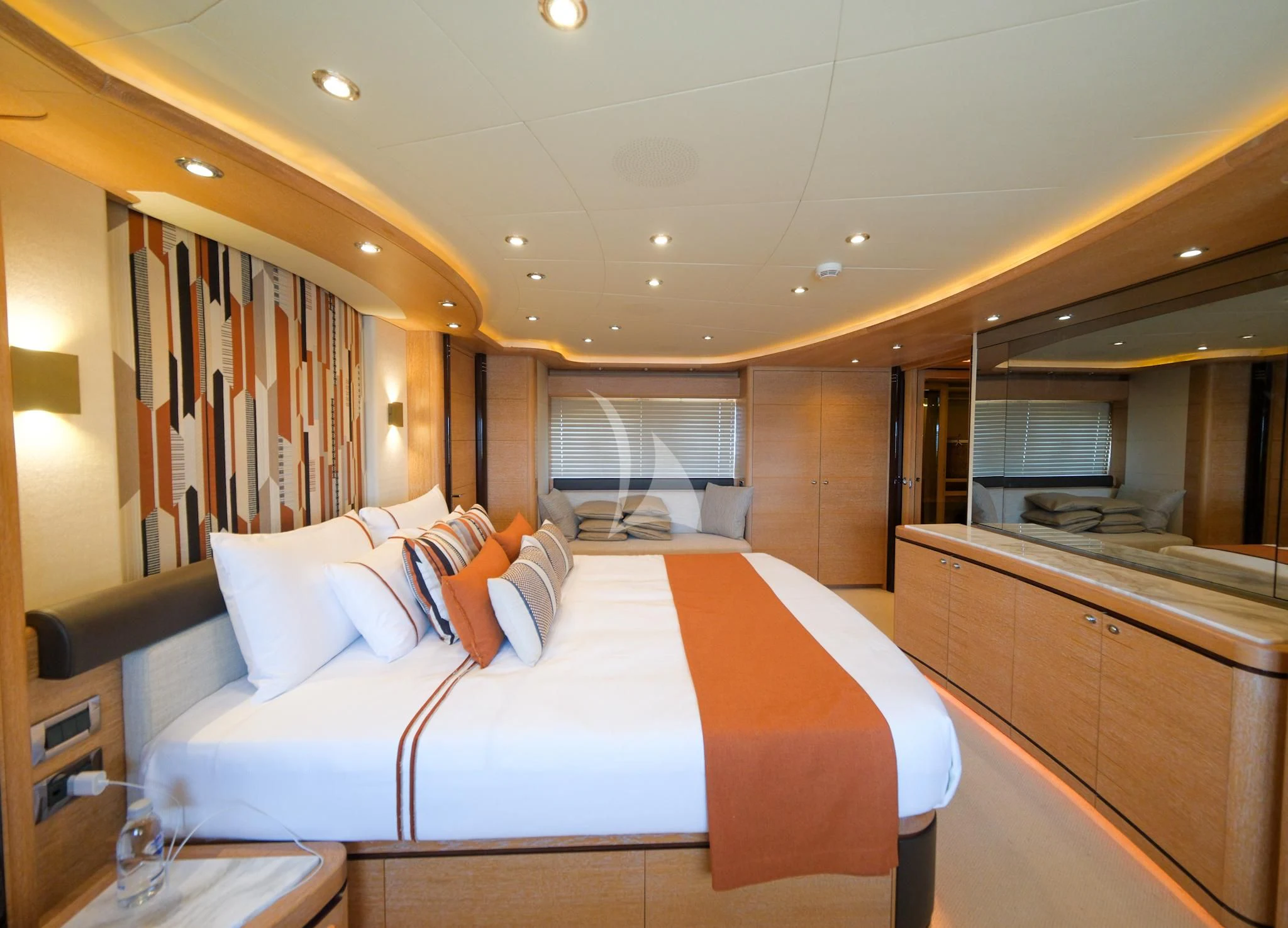 a large bedroom with a large bed aboard AERO Yacht for Charter