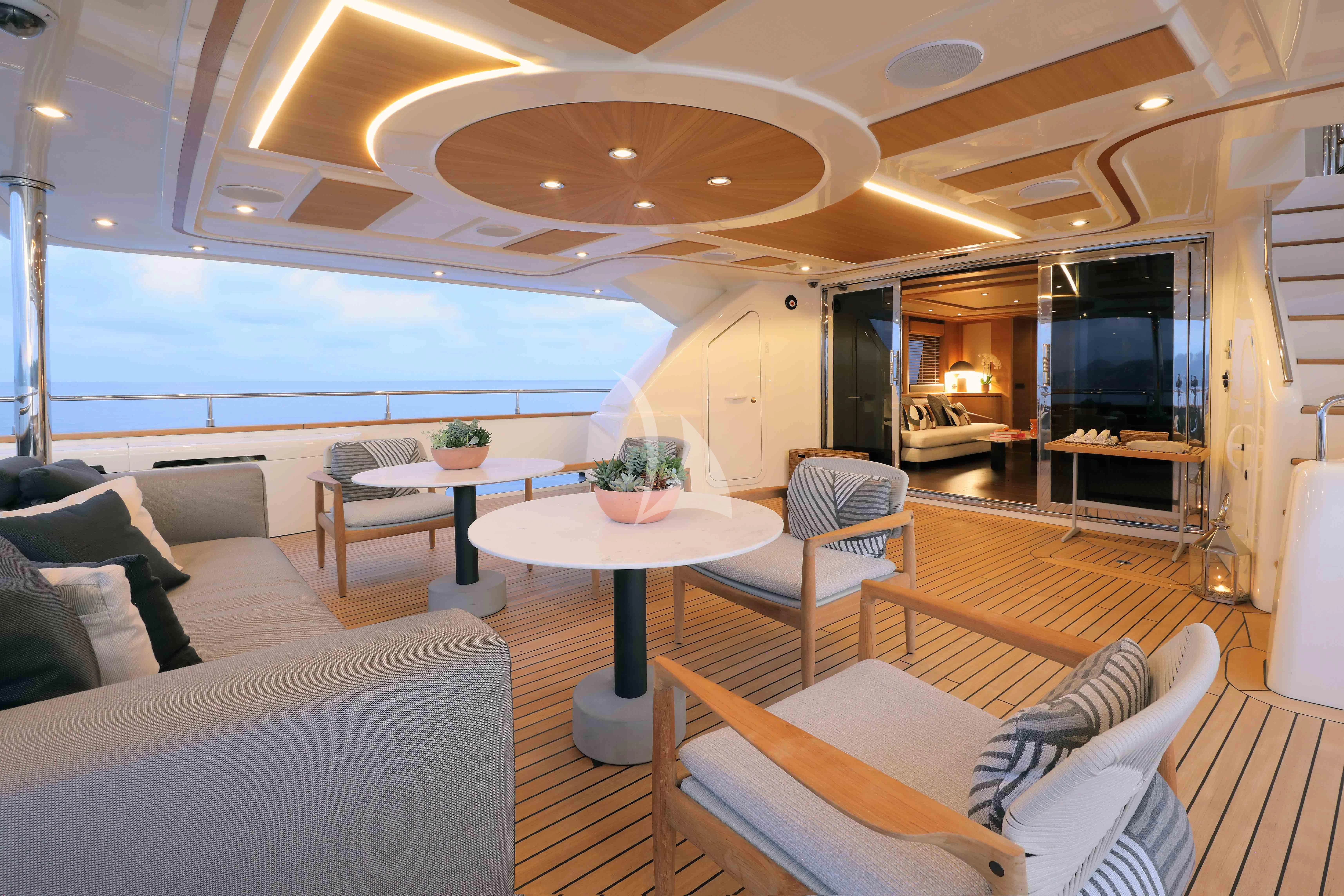 a living room with a table and chairs aboard AERO Yacht for Charter