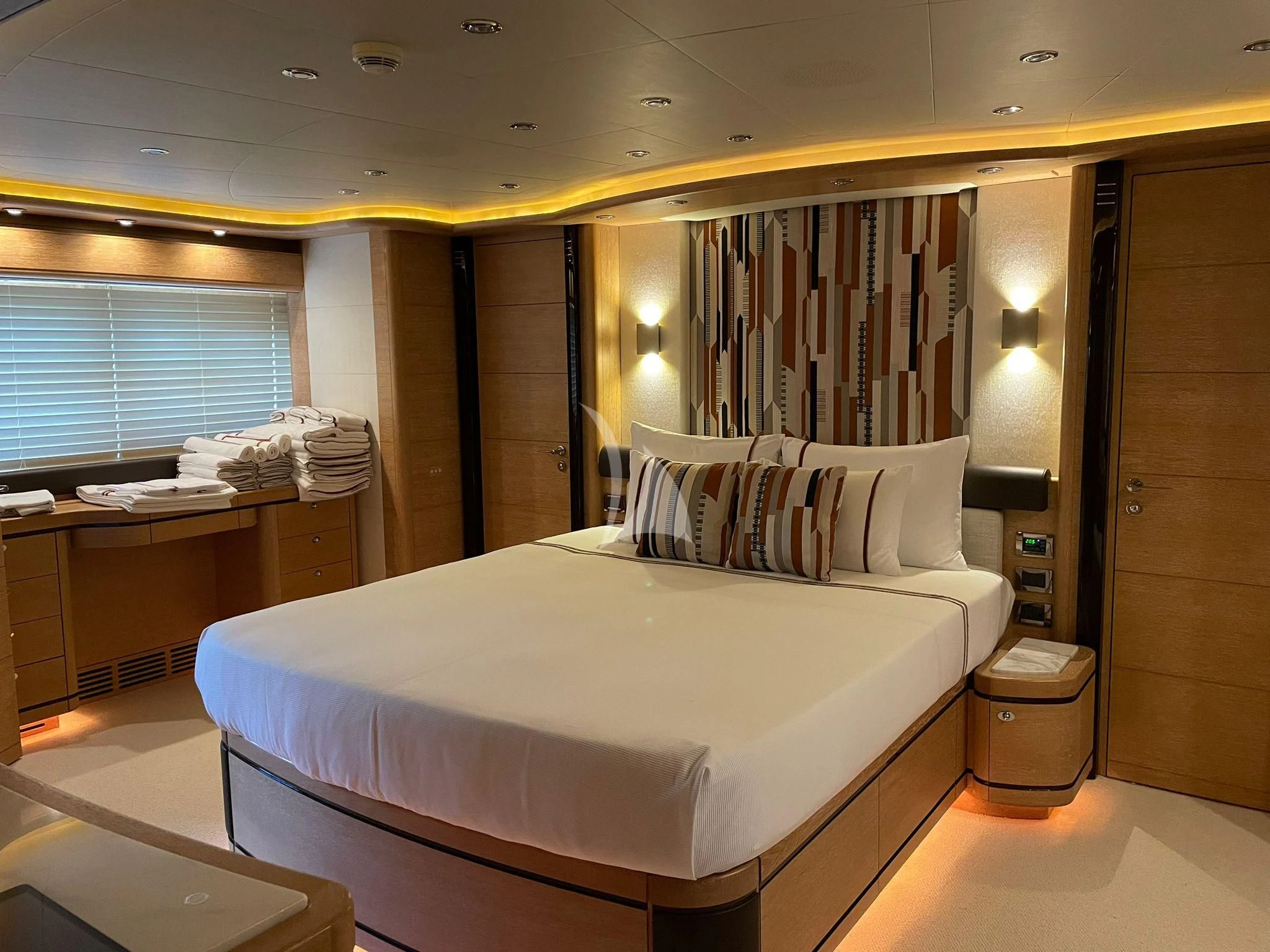 a large bed in a hotel room aboard AERO Yacht for Charter