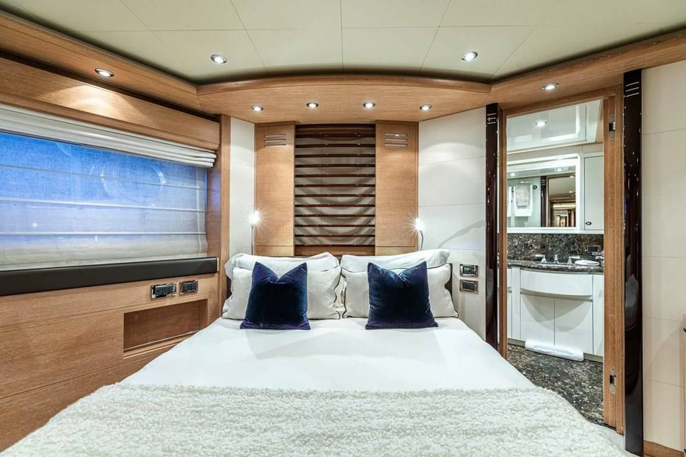 a bed in a hotel room aboard AERO Yacht for Charter