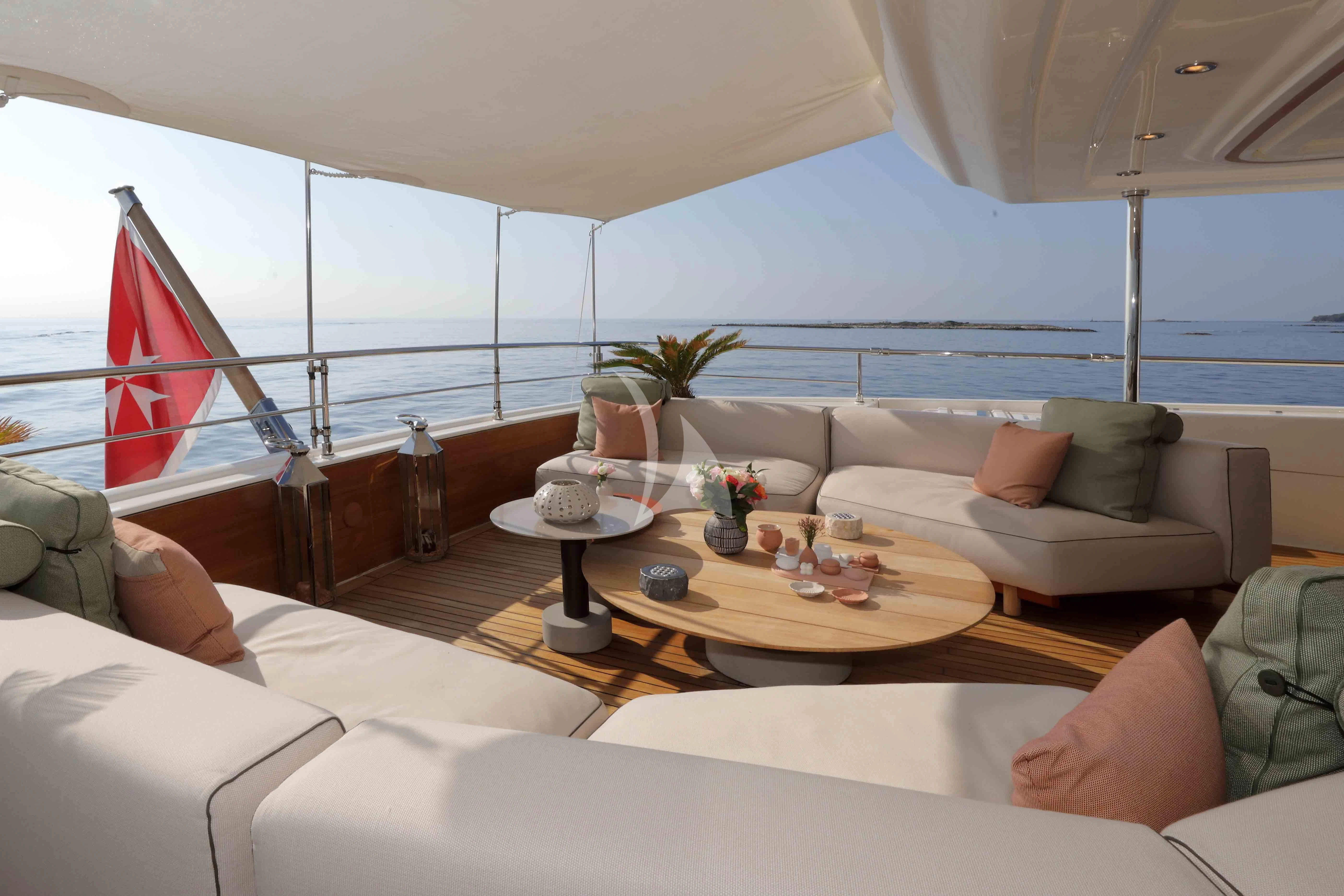 a living room with a large window aboard AERO Yacht for Charter
