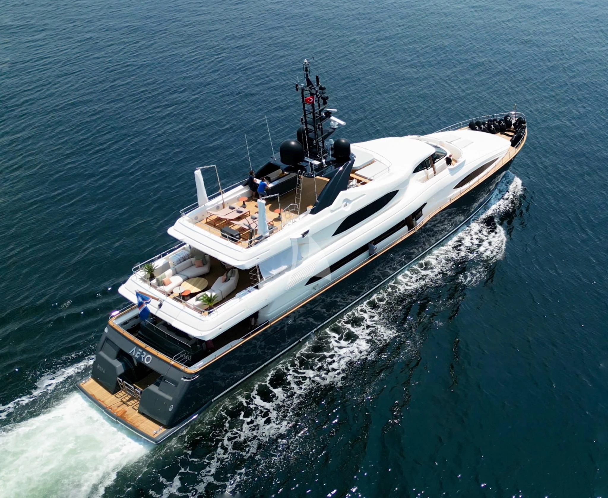 a military ship in the water aboard AERO Yacht for Charter