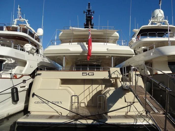 a boat docked at a pier aboard AERO Yacht for Charter