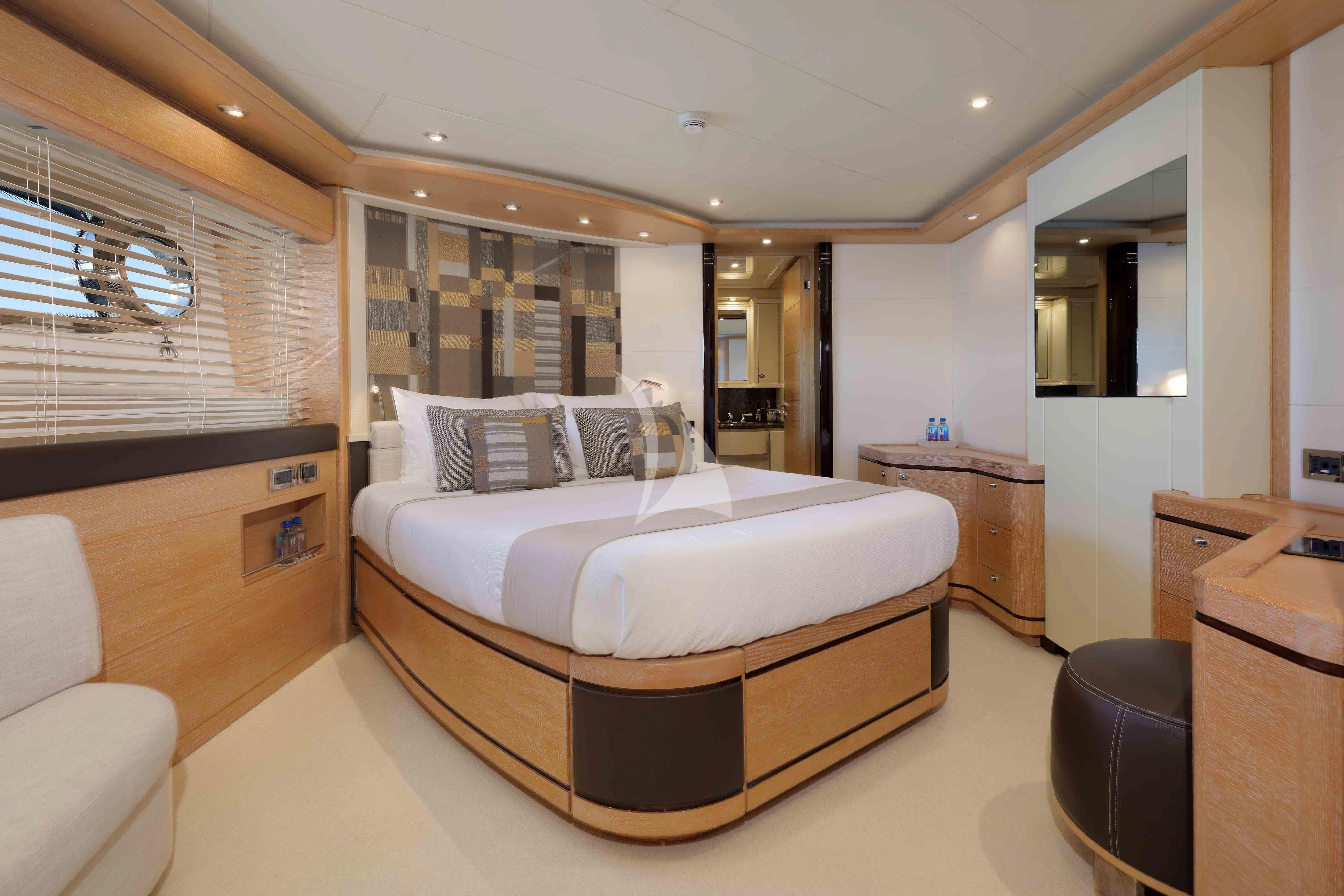 a large bedroom with a large bed aboard AERO Yacht for Charter