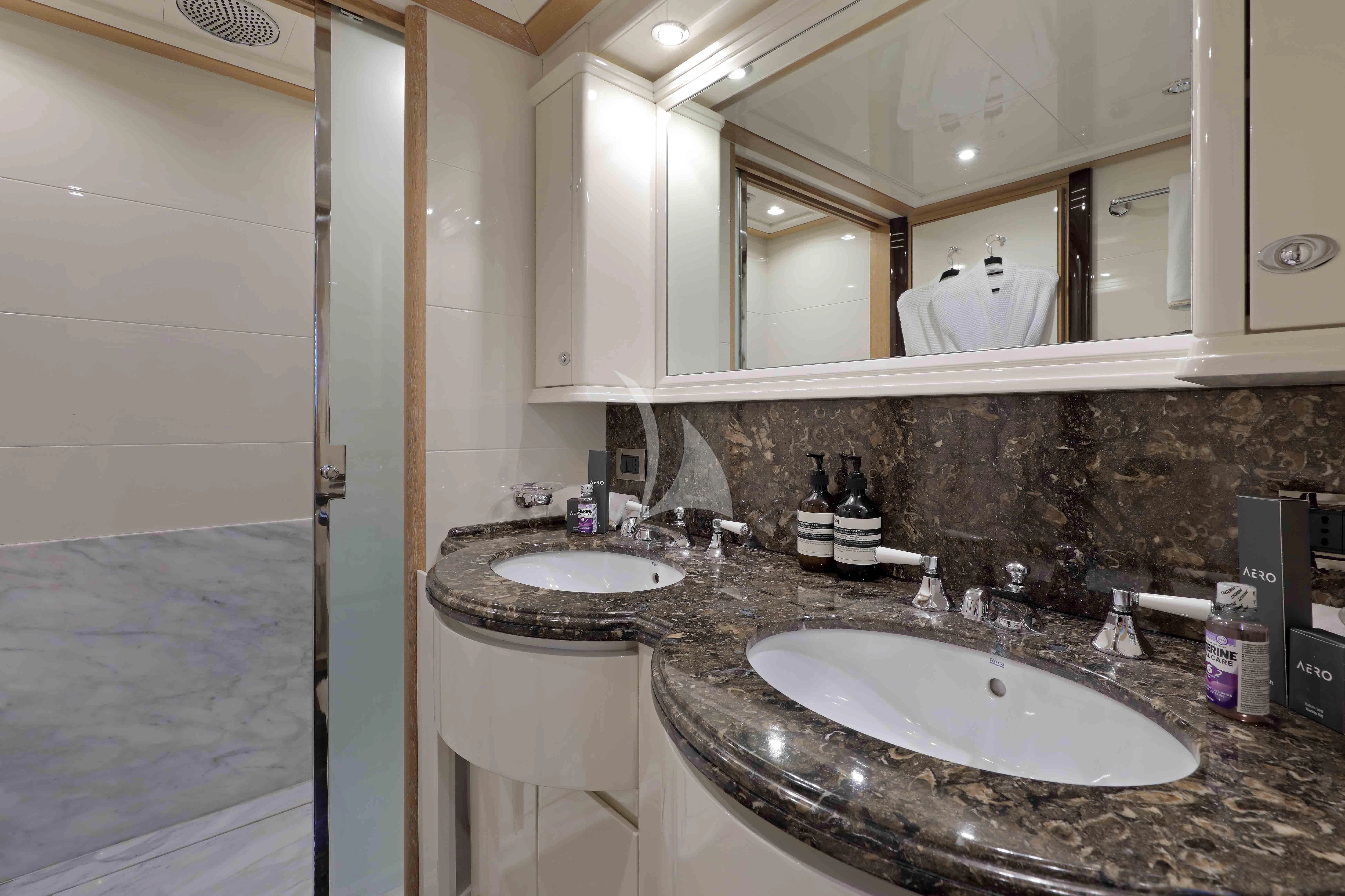 a bathroom with a sink and a mirror aboard AERO Yacht for Charter