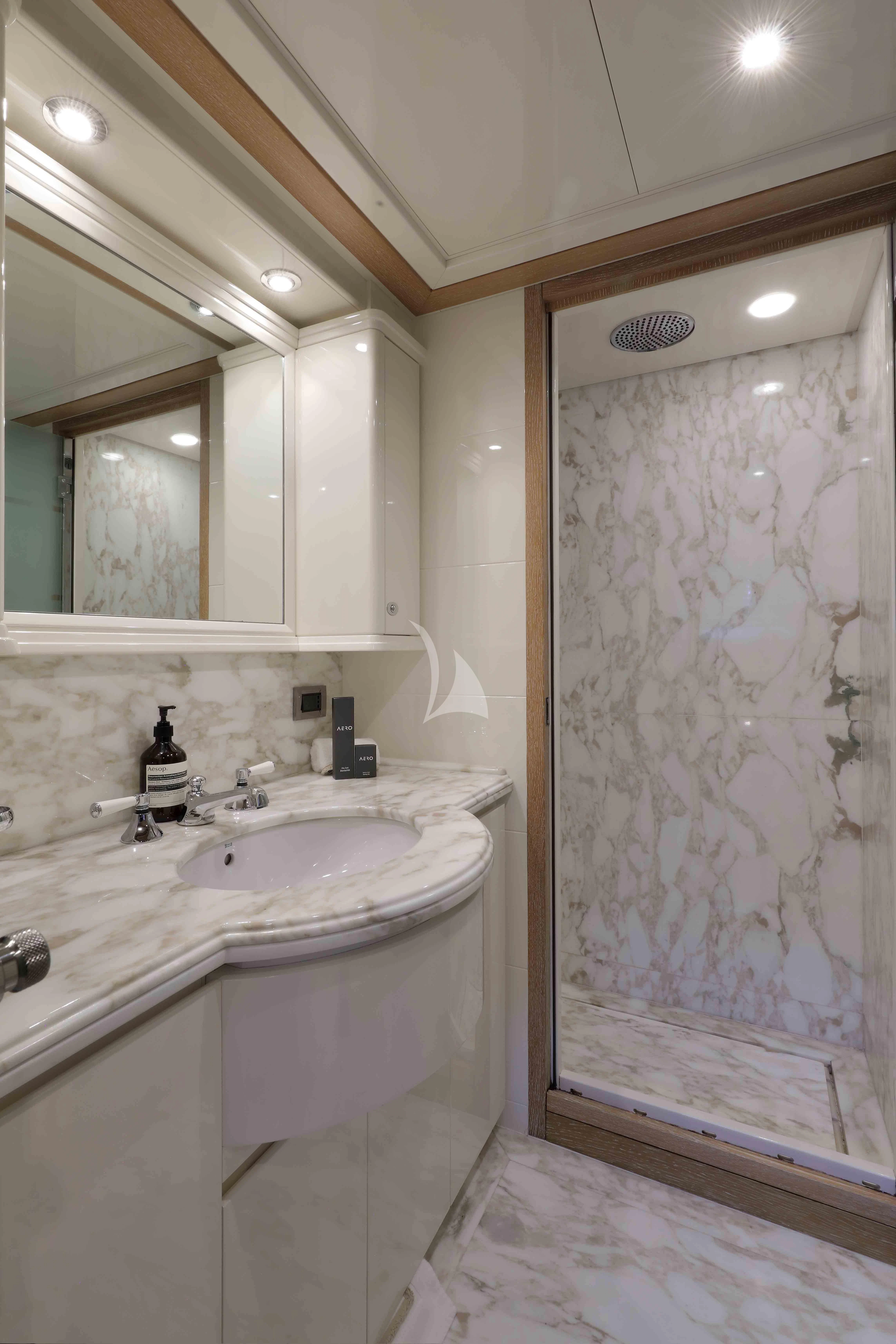 a bathroom with a sink and a shower aboard AERO Yacht for Charter