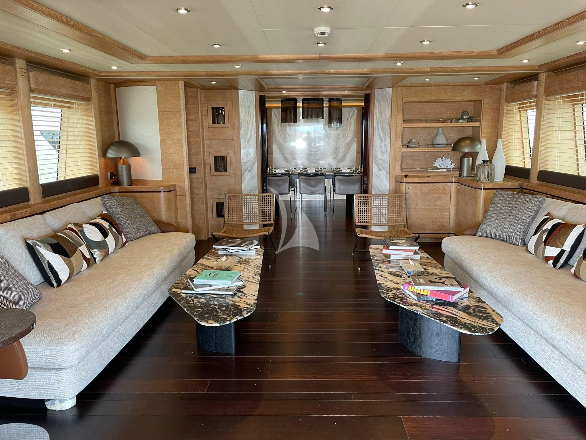 a living room with a wood floor aboard AERO Yacht for Charter