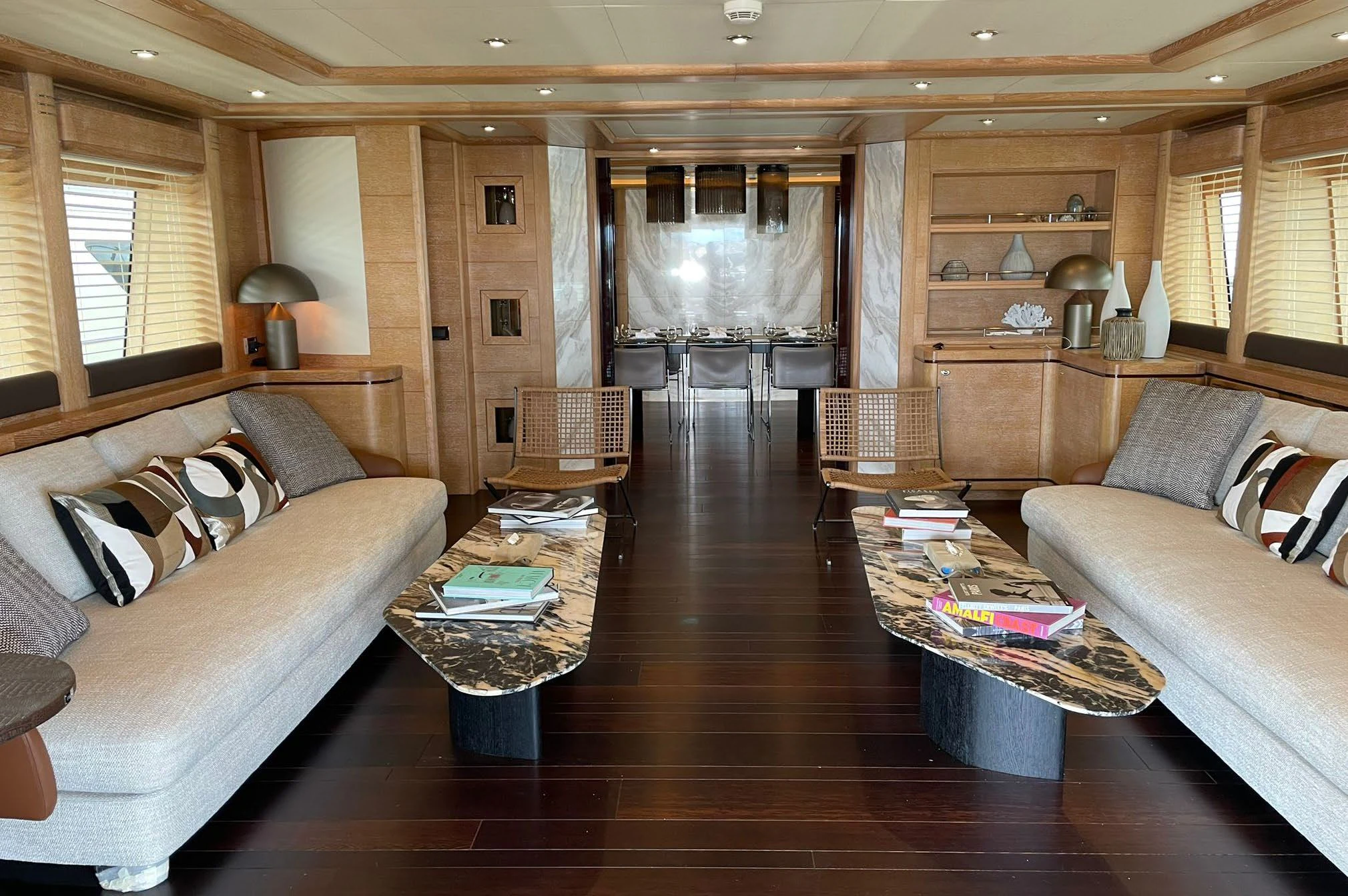 a living room with a wood floor aboard AERO Yacht for Charter