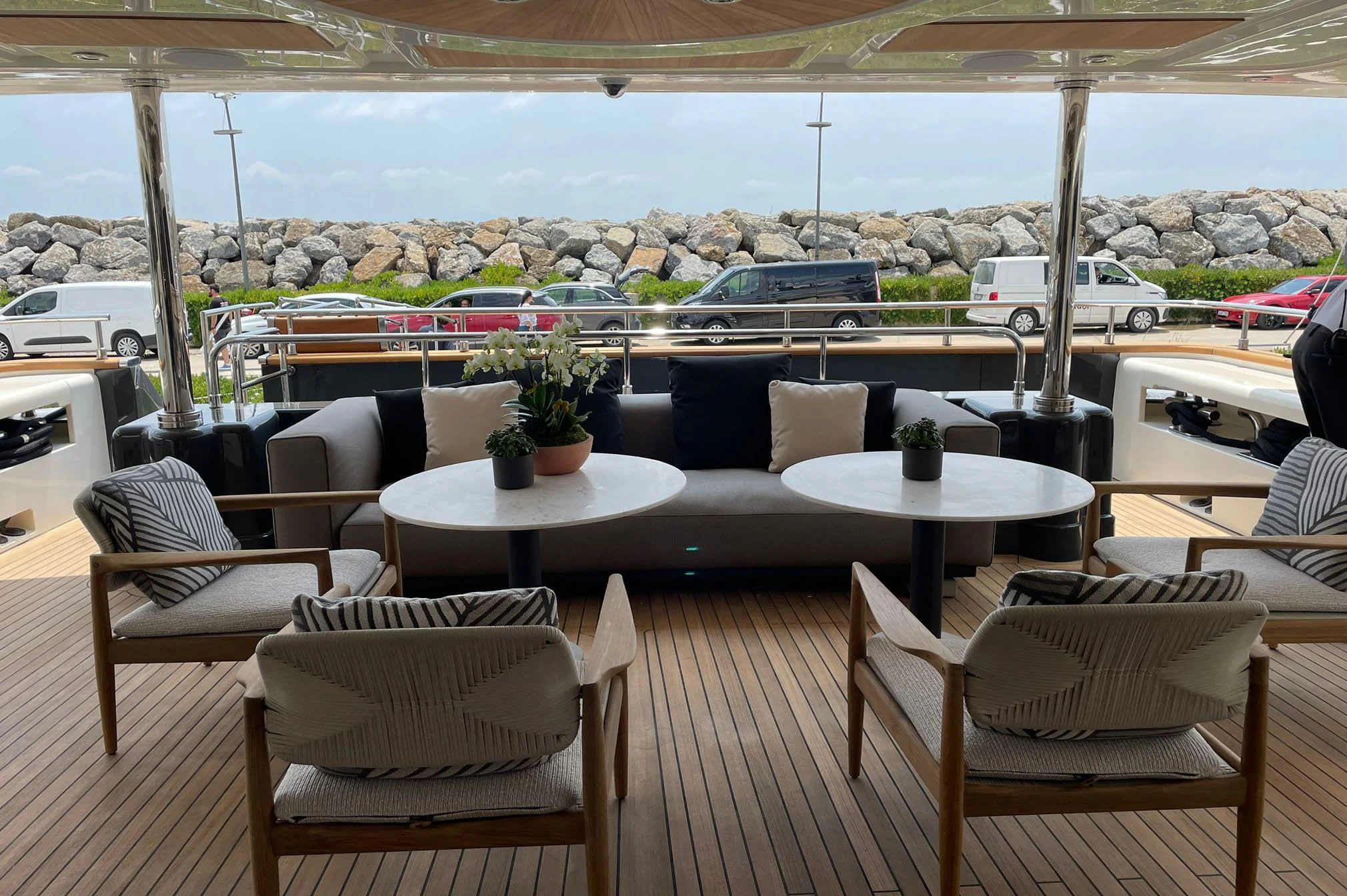 a patio with tables and chairs aboard AERO Yacht for Charter