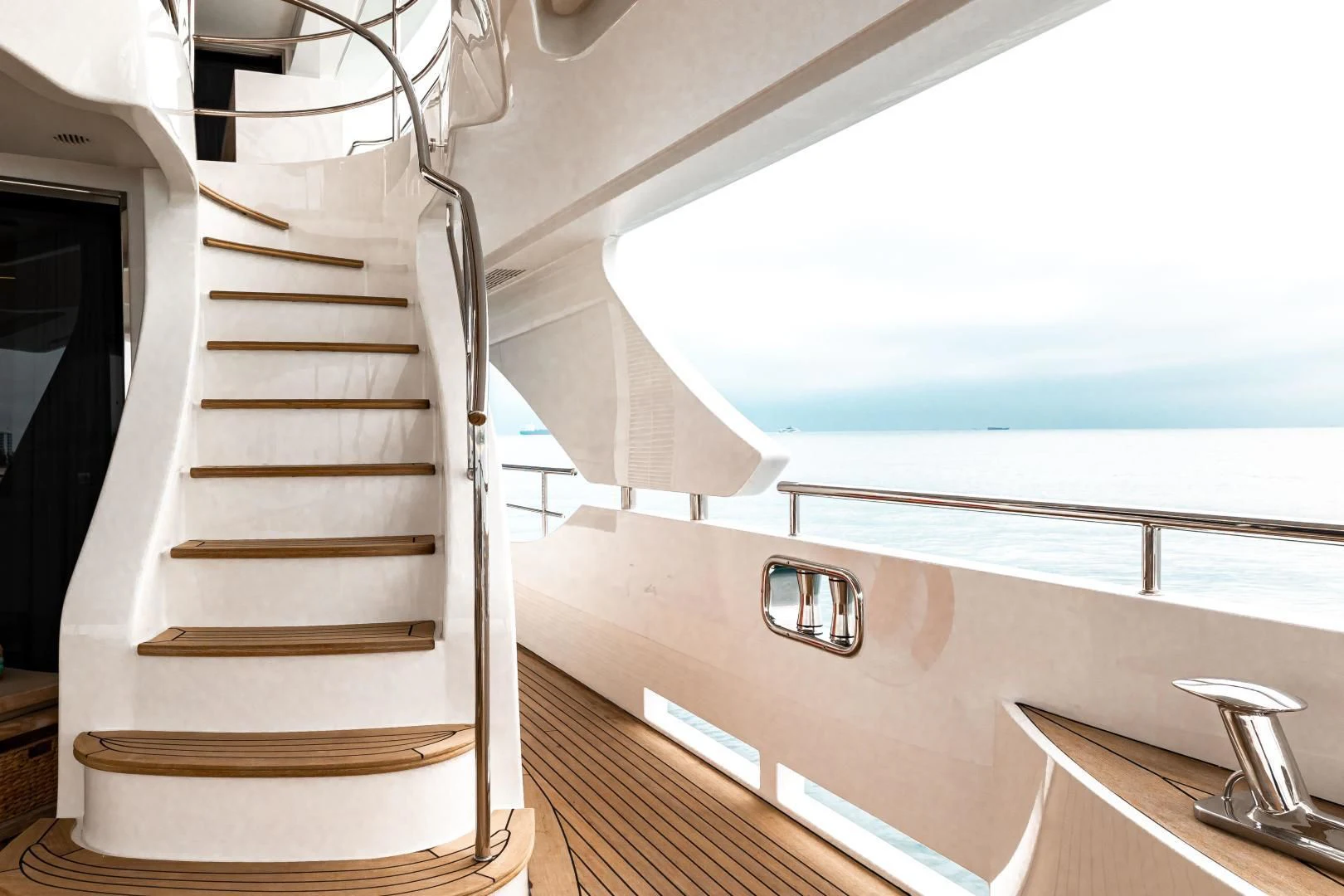 a staircase with a glass window aboard PATIENCE Yacht for Charter