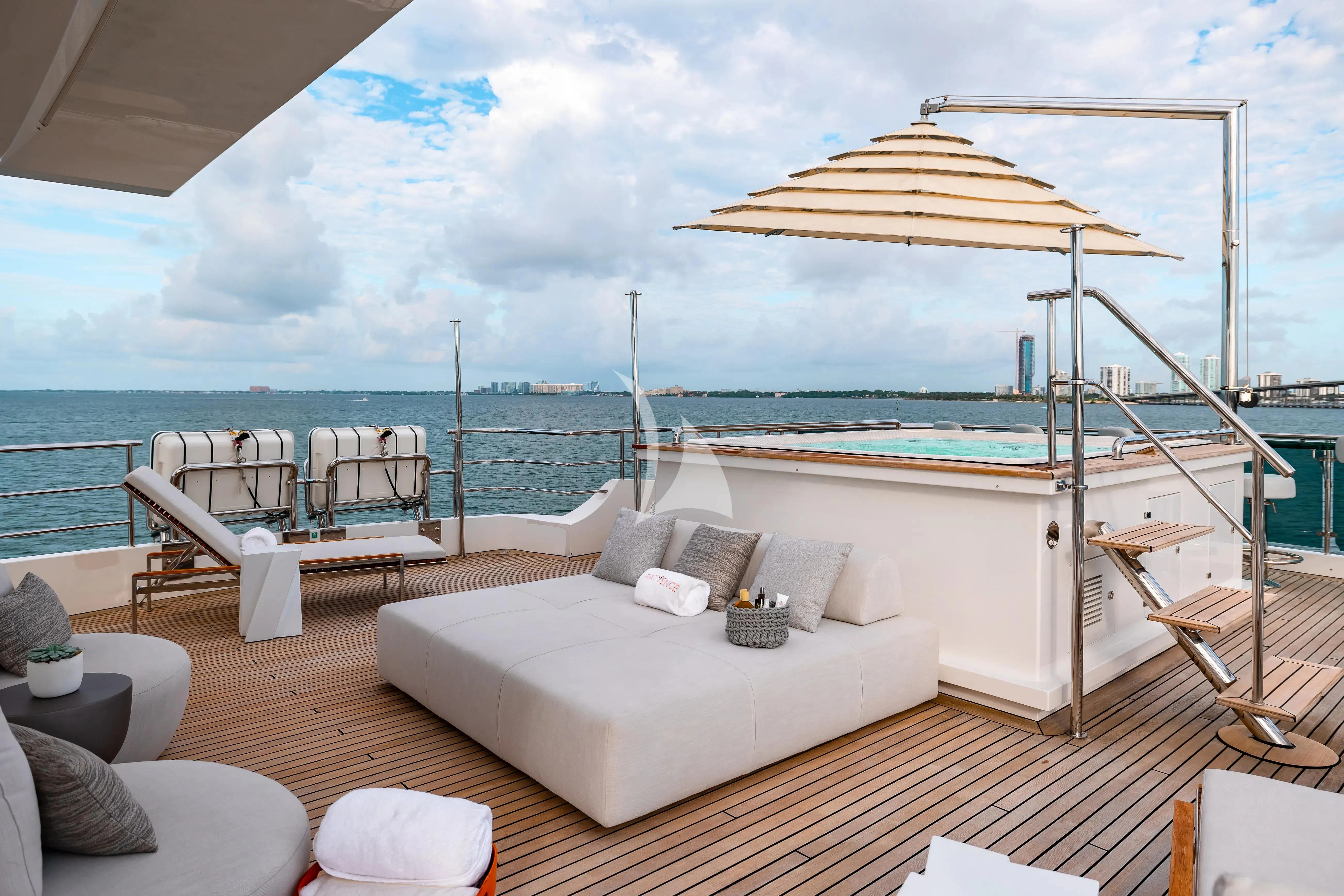 a large white bed on a deck aboard PATIENCE Yacht for Charter