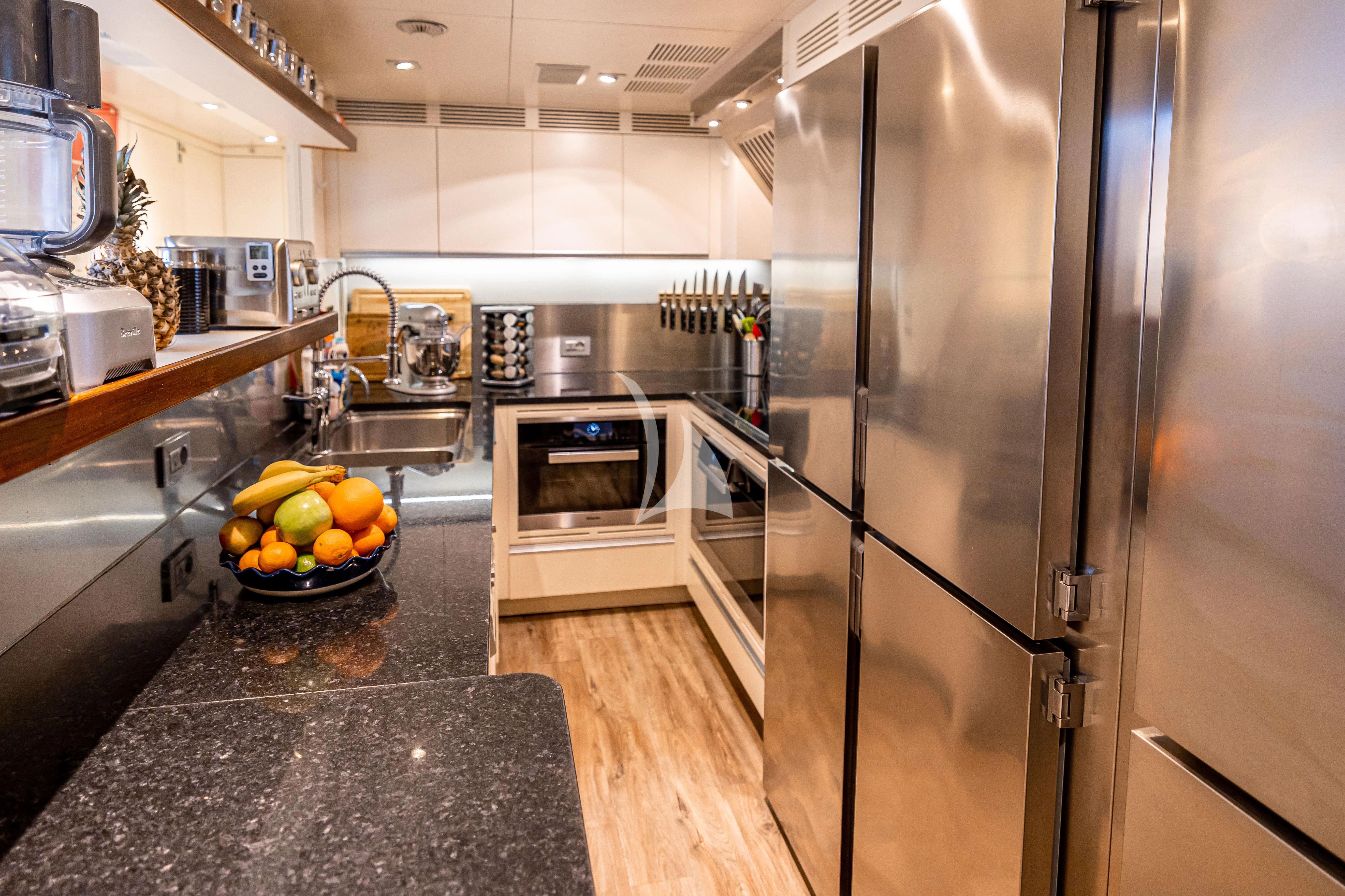 a kitchen with stainless steel appliances aboard PATIENCE Yacht for Charter
