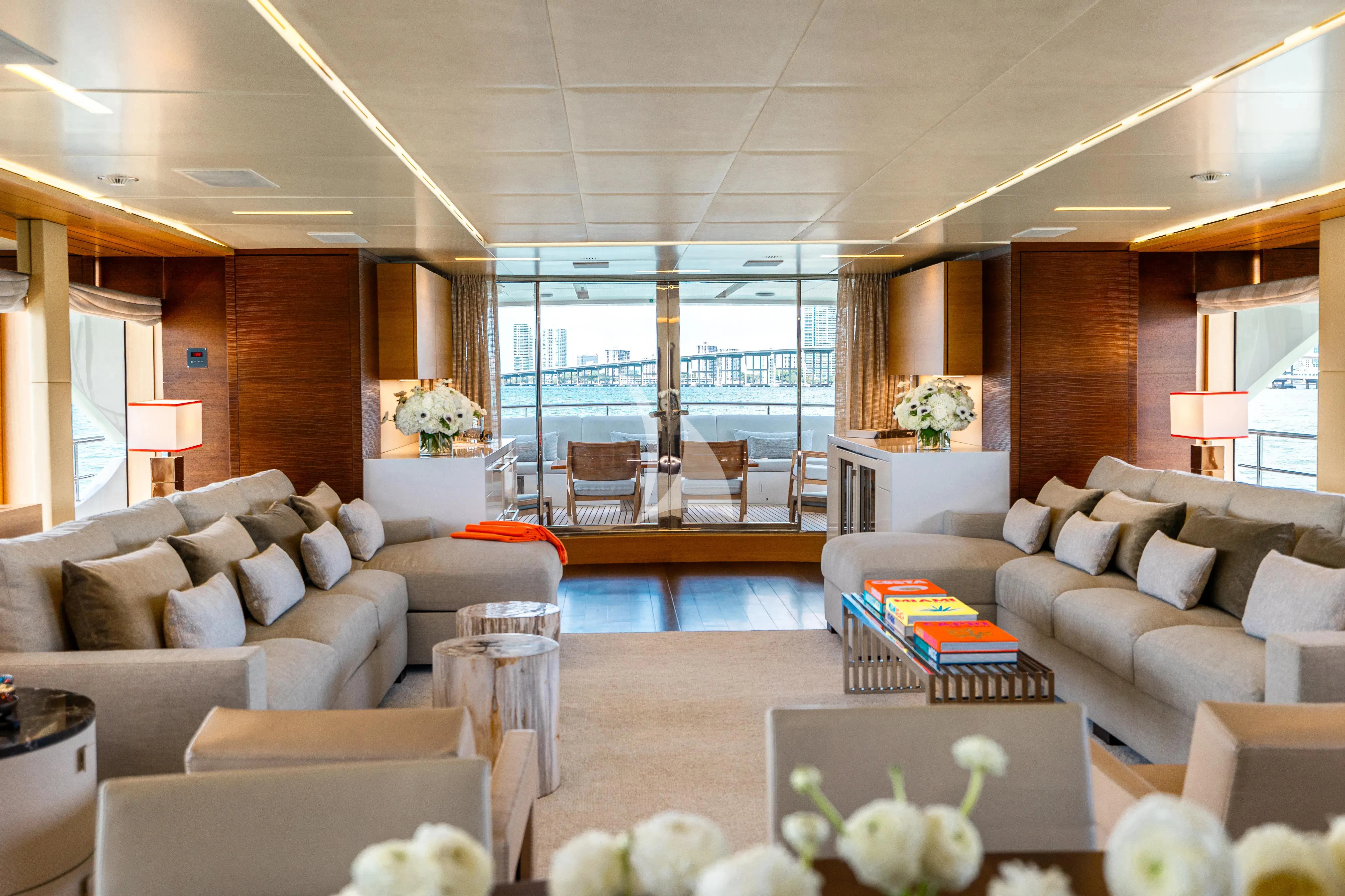 a living room with a large glass window aboard PATIENCE Yacht for Charter