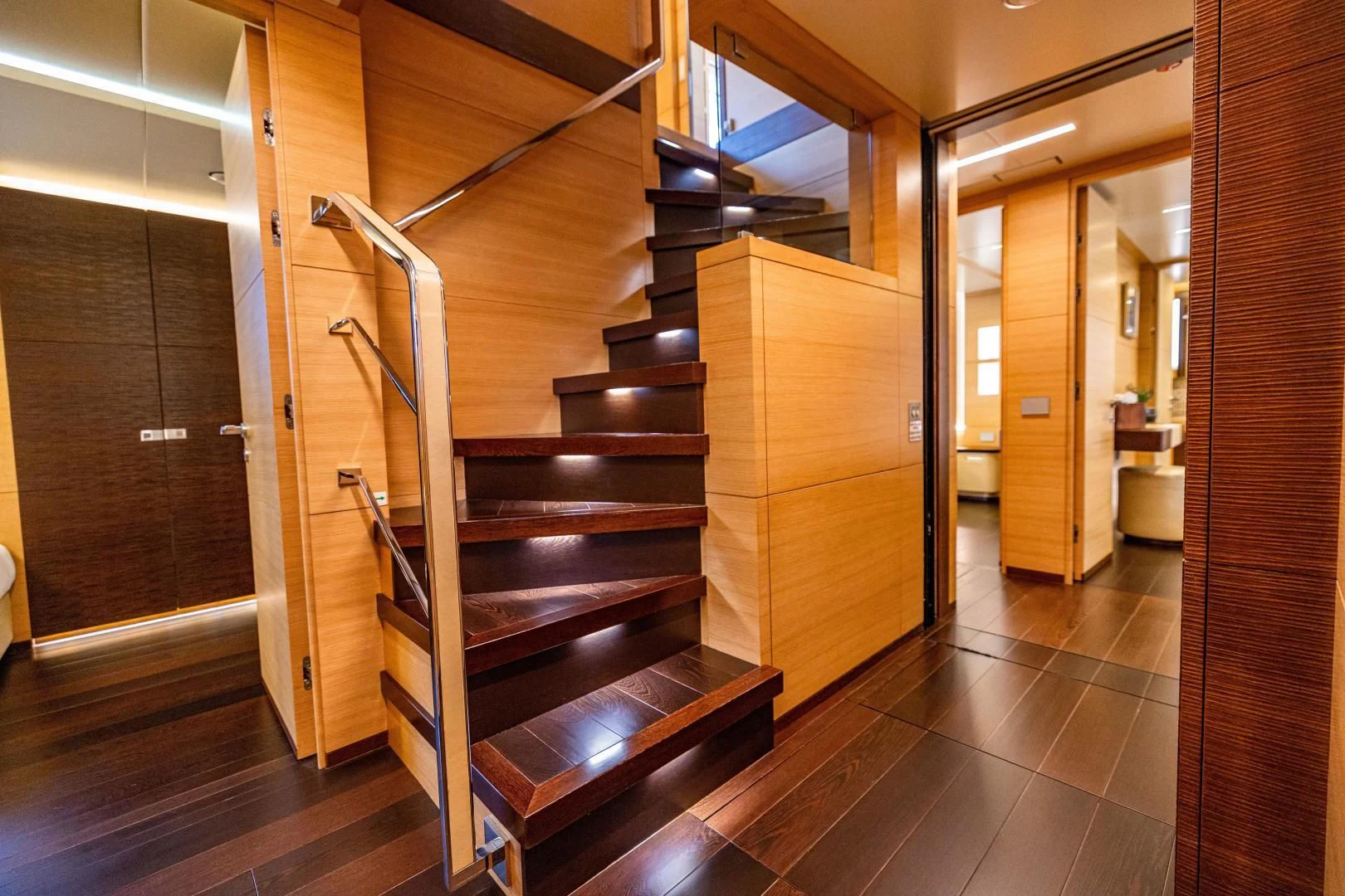 a wooden staircase in a room aboard PATIENCE Yacht for Charter