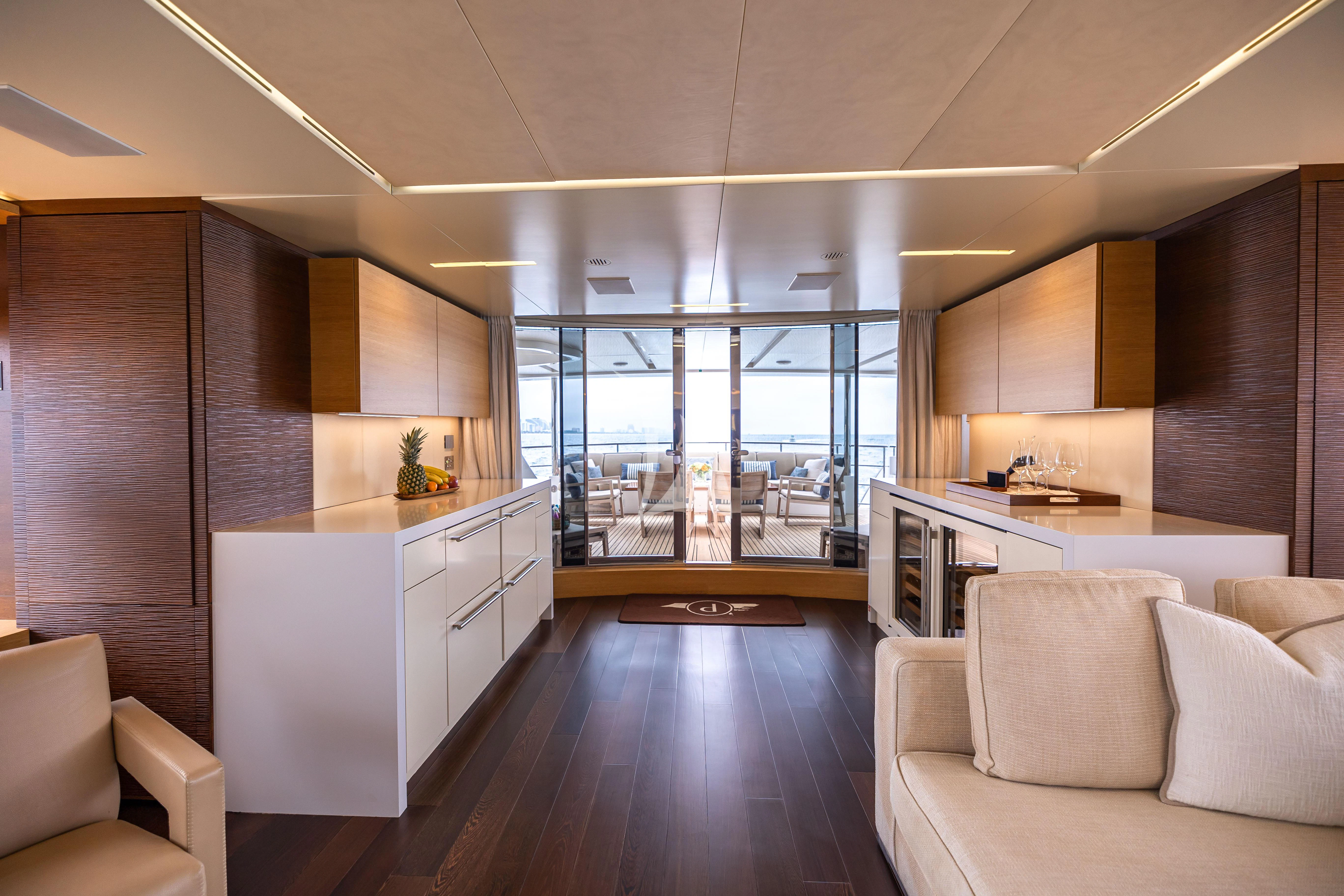 a room with a wood floor and white cabinets and a wood floor aboard PATIENCE Yacht for Charter