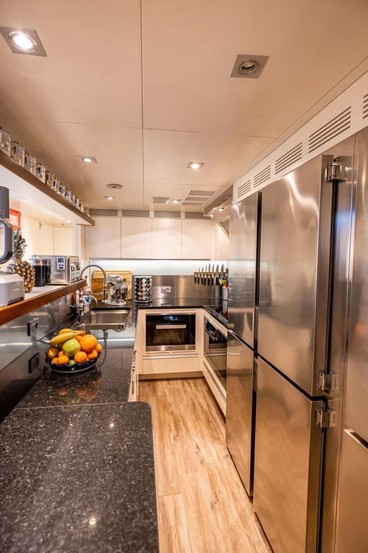 a kitchen with stainless steel appliances aboard PATIENCE Yacht for Charter