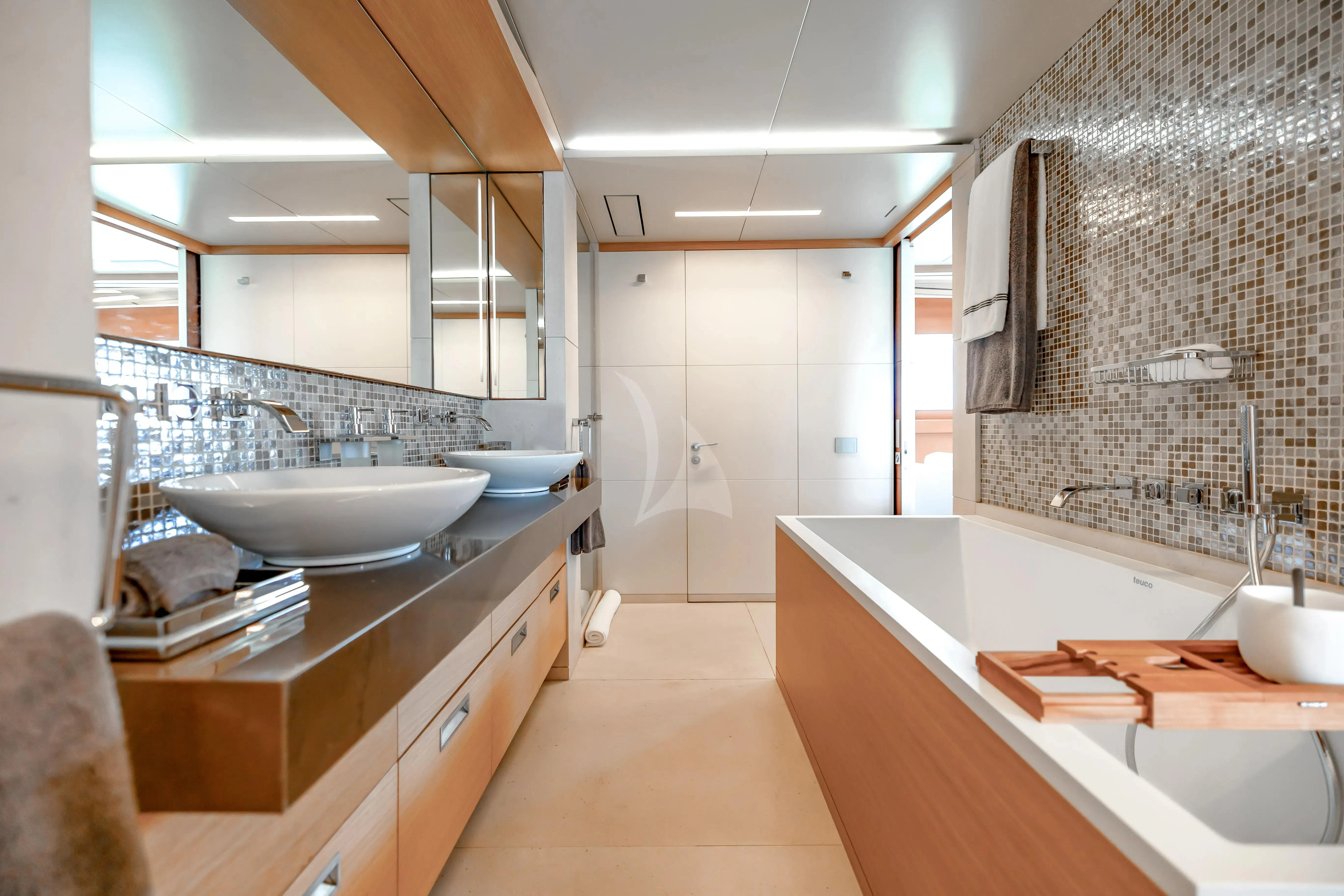 a bathroom with a sink and bathtub aboard PATIENCE Yacht for Charter