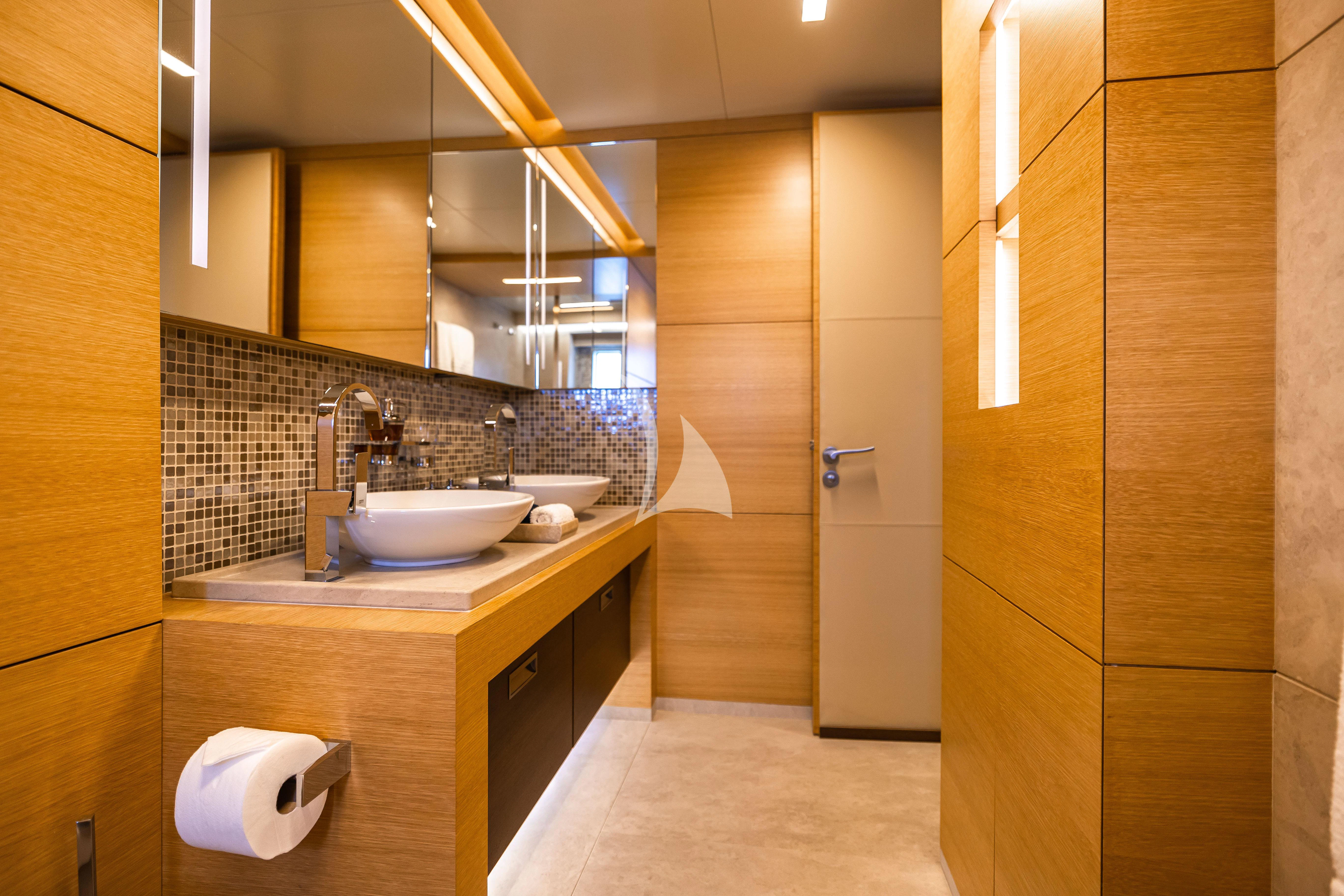 a bathroom with a sink and a mirror aboard PATIENCE Yacht for Charter