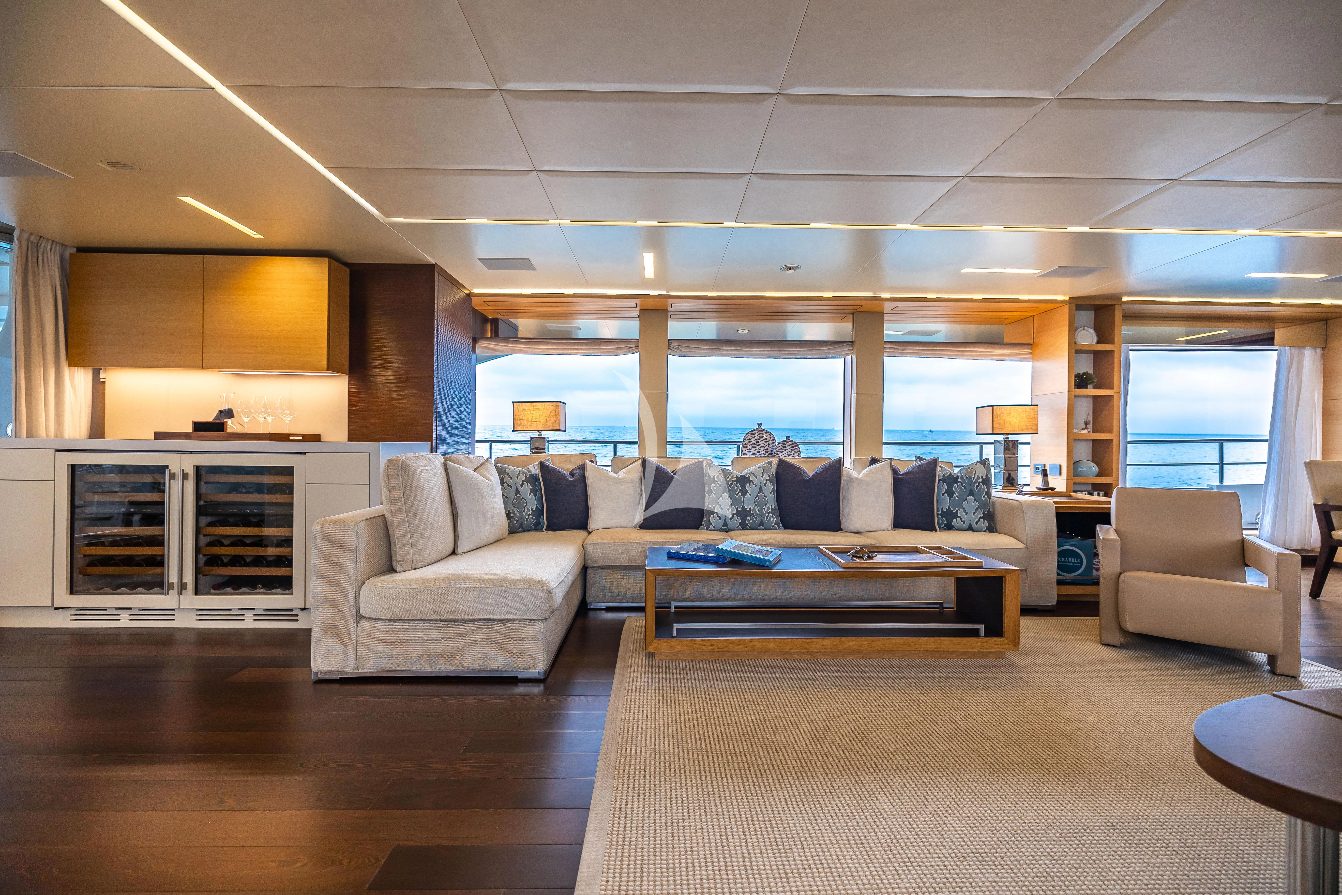 a living room with a large window aboard PATIENCE Yacht for Charter