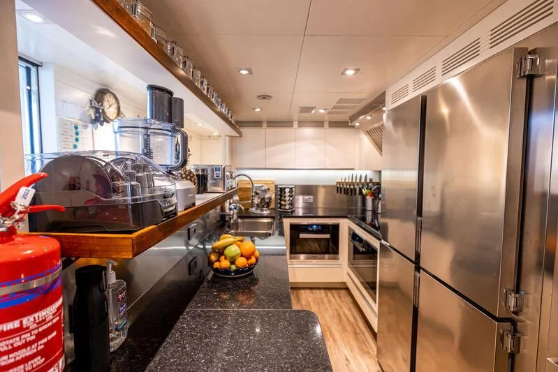 a kitchen with stainless steel appliances aboard PATIENCE Yacht for Charter